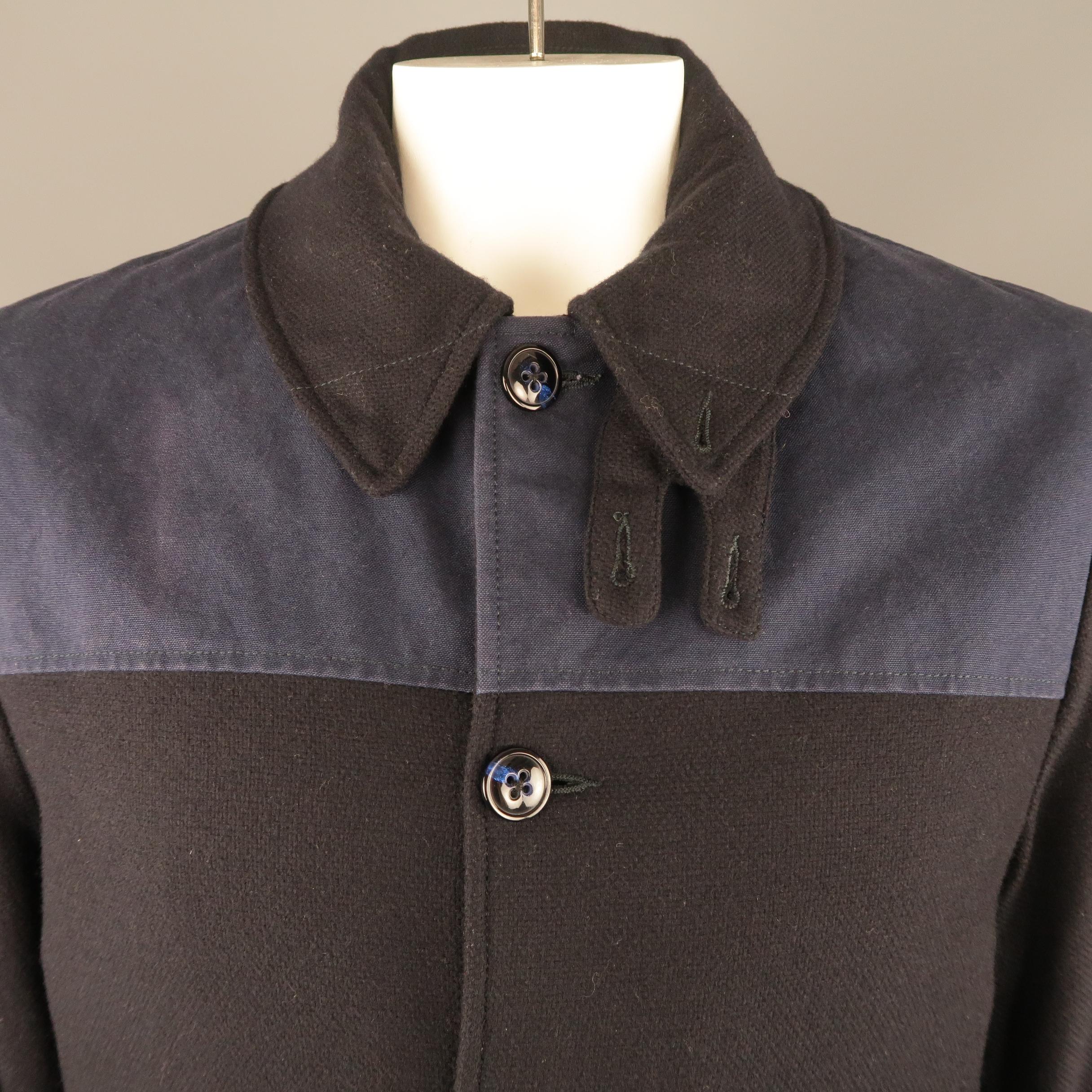 ADAM KIMMEL coat comes in a navy wool knit with blue canvas chest panel, flap pockets, and quilted liner. Minor wear. As-is. Made in Italy.
 
Good Pre-Owned Condition.
Marked: L
 
Measurements:
 
Shoulder: 18 in.
Chest: 46 in.
Sleeve: 27 in.
Length: