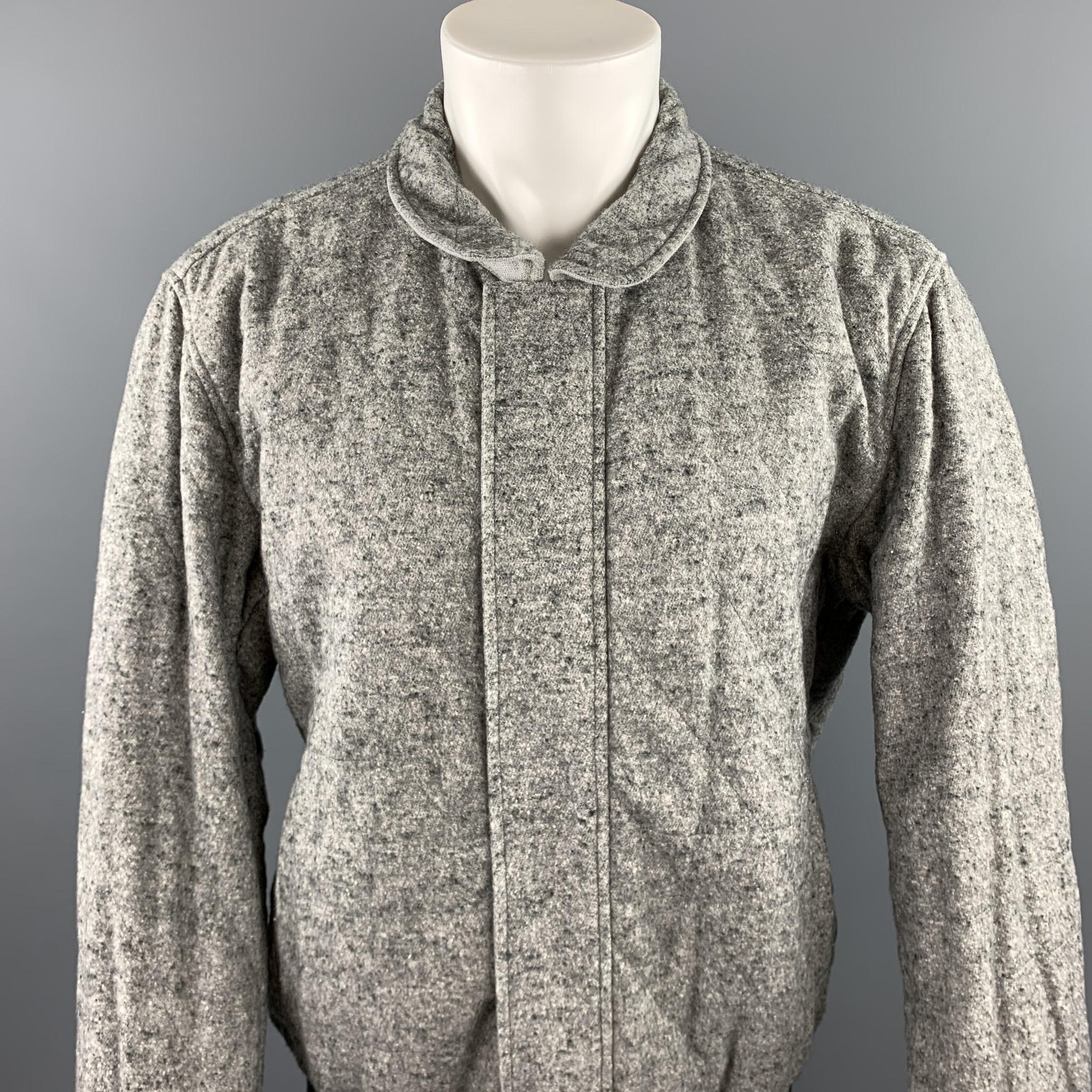 ADAM KIMMEL jacket comes in a grey heather cotton blend featuring a reversible style, ribbed hem, slit pockets, and a hidden zip up closure. Made in Italy.

Very Good Pre-Owned Condition.
Marked: L

Measurements:

Shoulder: 20 in. 
Chest: 44 in.