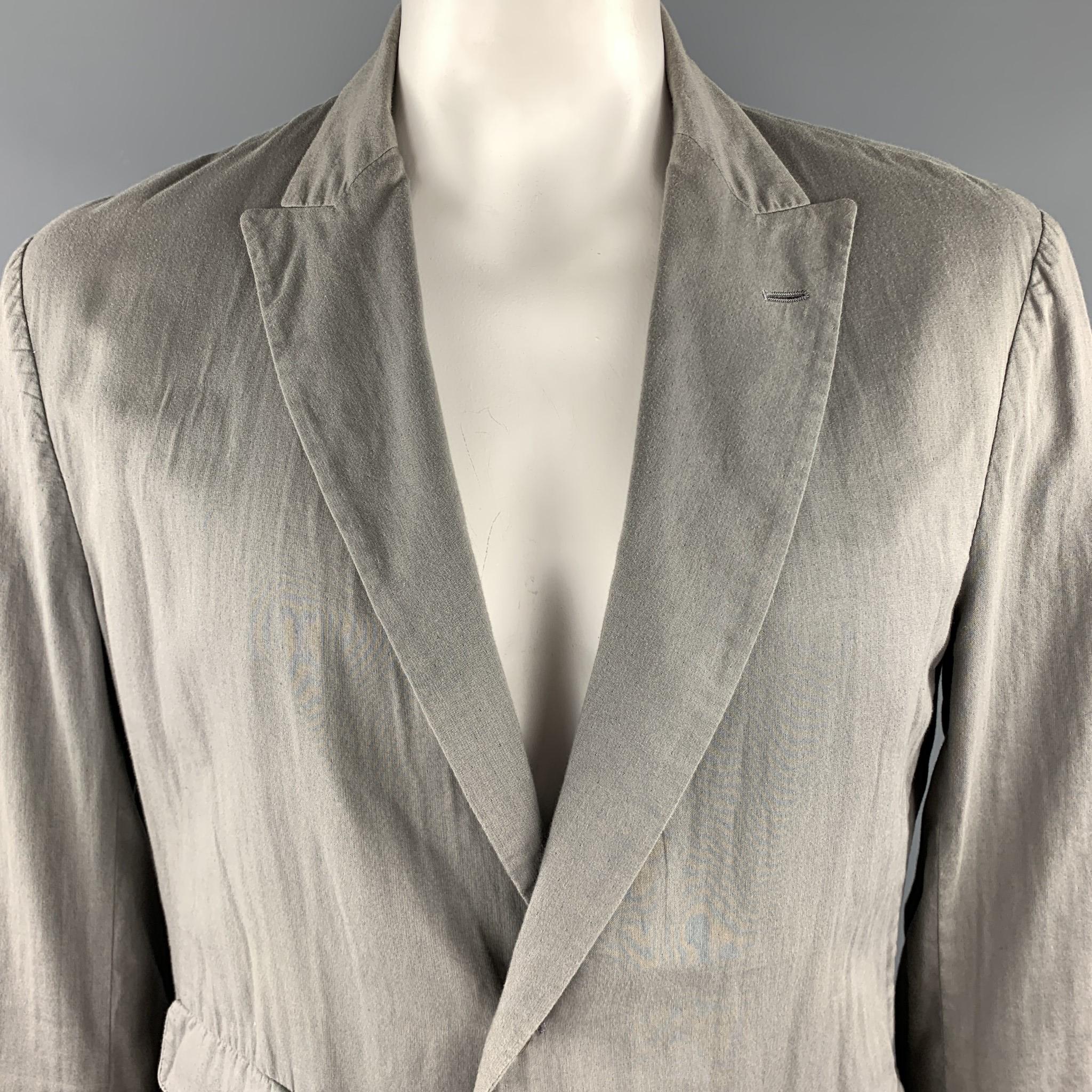 ADAM KIMMEL sport coat comes in soft grey unpressed cotton with a peak lapel, single breasted, two button front, and triple flap pockets. Made in Italy.

Very Good Pre-Owned Condition. 
Marked: XL

Measurements:

Shoulder: 19 in.
Chest: 48
