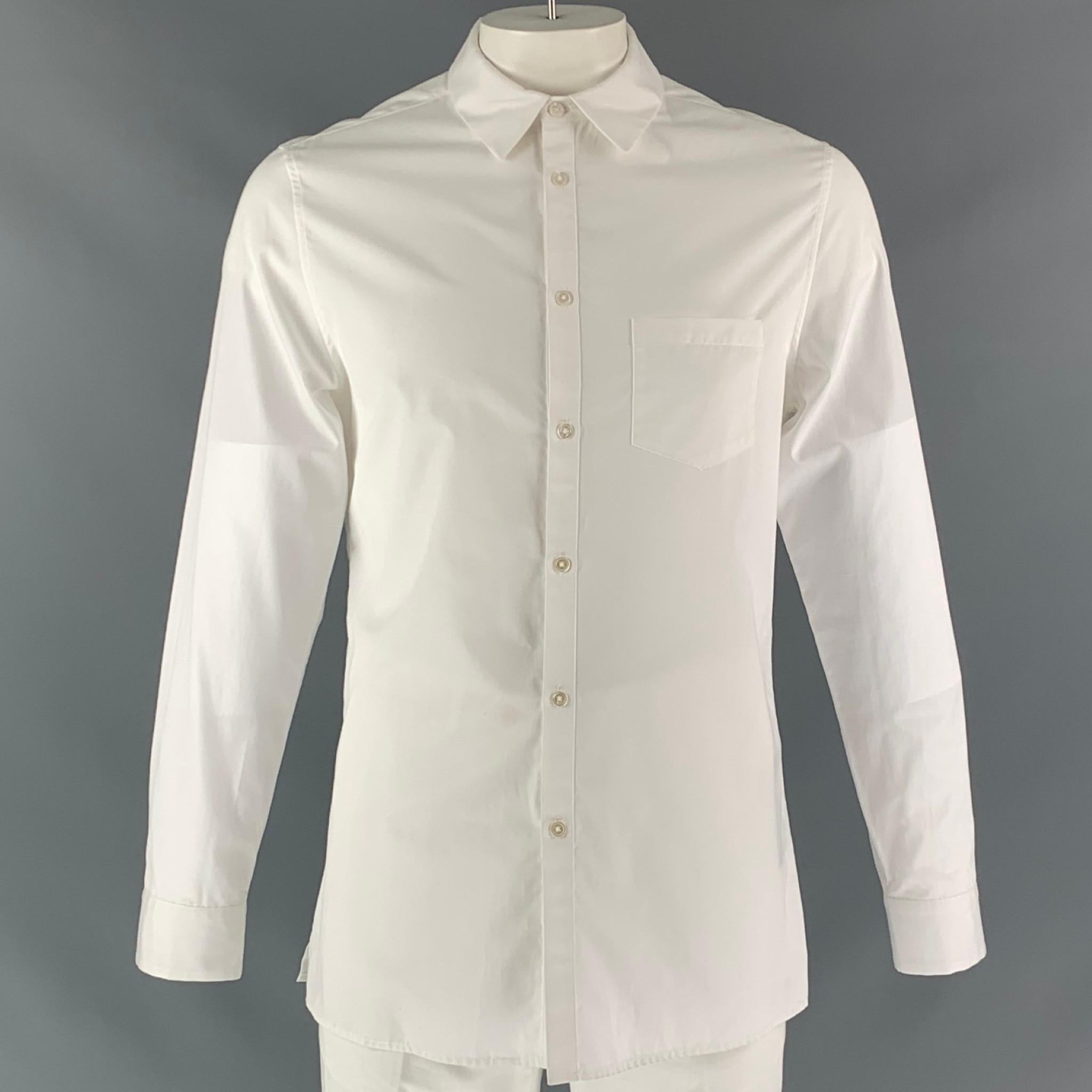 ADAM LIPPES long sleeve dress shirt comes in white cotton fabric, button up closure, spread collar and one button square sleeve cuff.

New with Tags.
Marked: L

Measurements:

Shoulder: 18 in
Chest: 44 in
Sleeve: 26 in
Length: 31 in 

 