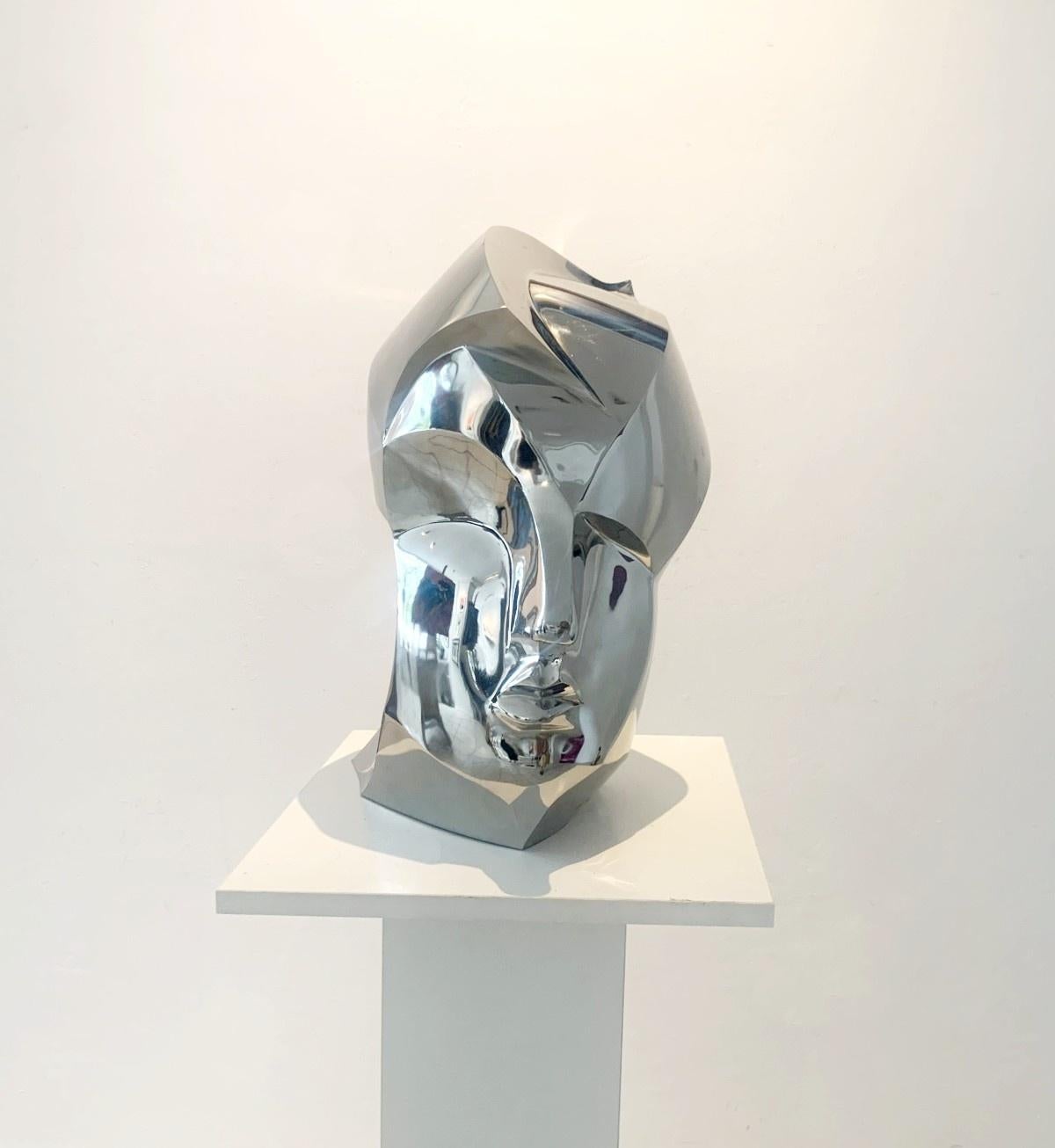 Adam Myjak Figurative Sculpture - A head. Steel sculpture, minimalistic, cubism, Polish art classic