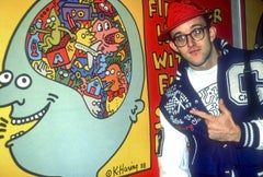 Keith Haring Pointing to One of His Paintings Fine Art Print