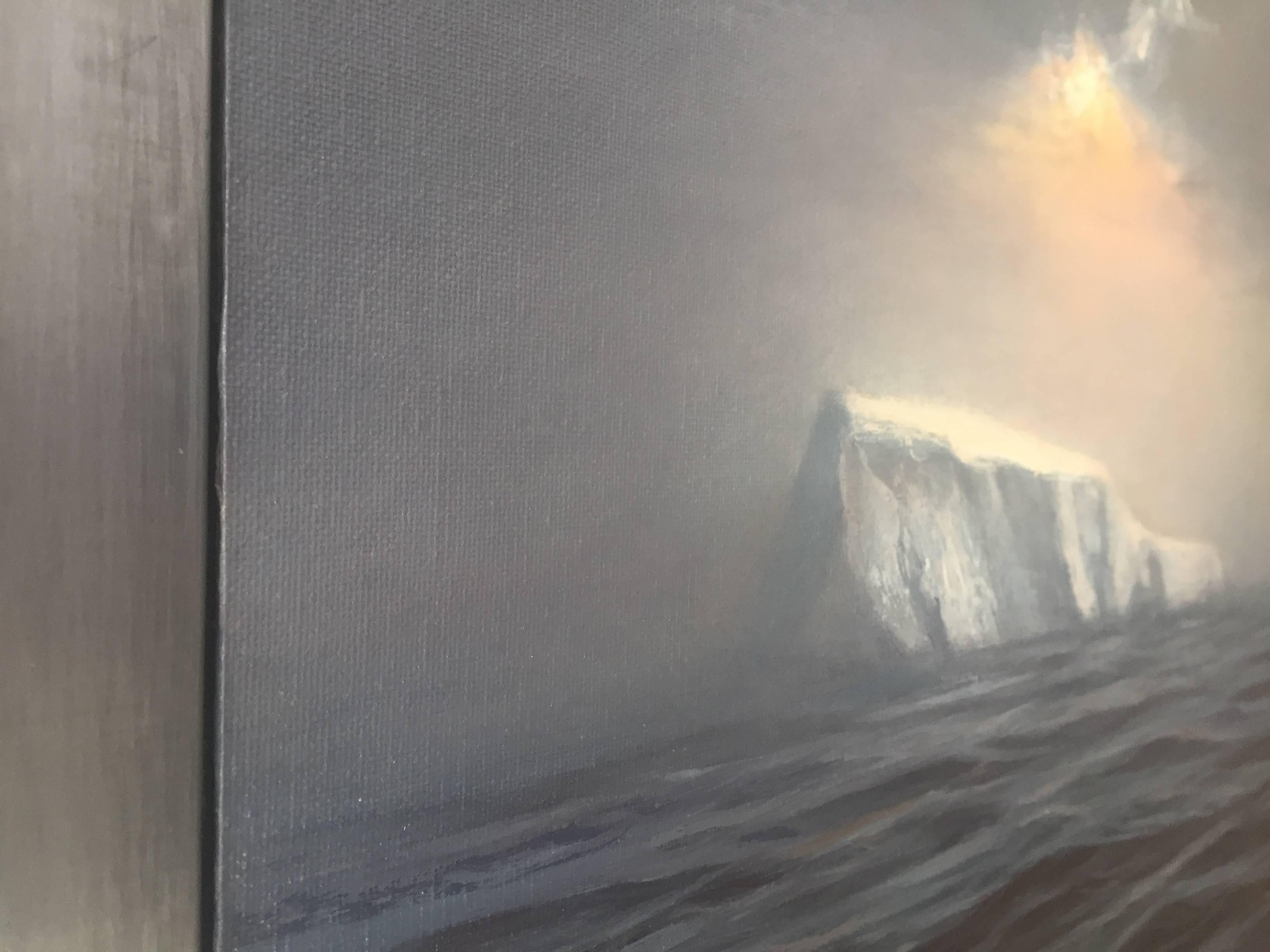 An oil painting encased in a lead frame. An iceberg peaks out of the dark, vast ocean. Strong geometric forms strike with weight against the fluidity of water, and glisten in reflection of the glowing golden skylight above. Light peeks out from an