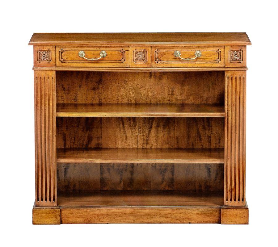 This superb beech bookcase is a stately design made to last and complement classic homes with unprecedented refinement. A minute reproduction of an authentic Adam-style piece from circa 1780-1820, it flaunts hand-carved grooves on the sides, coupled