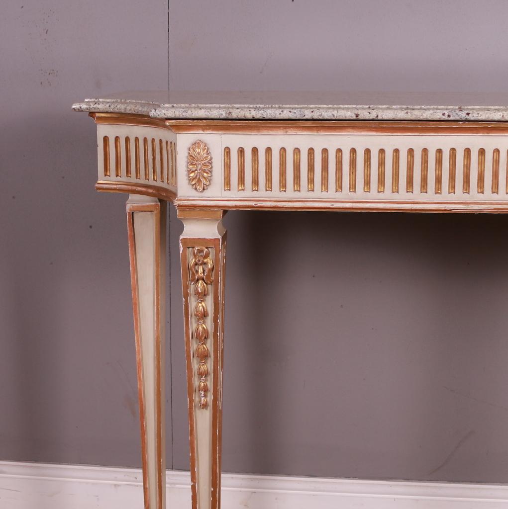 Late 19th C Adam style console table with marble top. 1890.

Dimensions
56 inches (142 cms) wide
18 inches (46 cms) deep
38 inches (97 cms) high.

    
