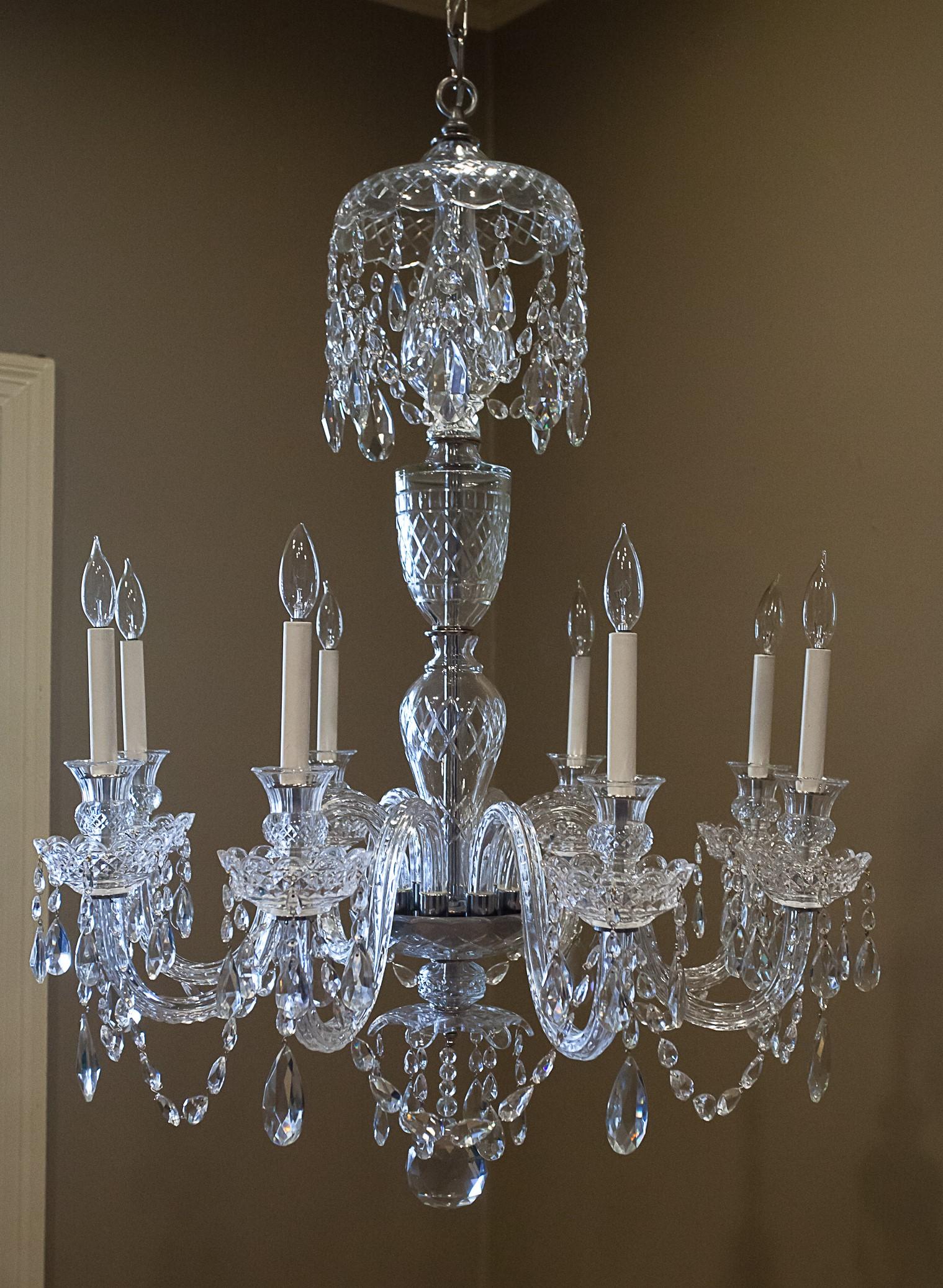 Georgian style lead crystal chandelier. Based on a late 18th century design. Handcut prisms and hand blown and cut arms, bobeches and candle cups. Ceiling cap, hanging hardware and one foot of chain included.