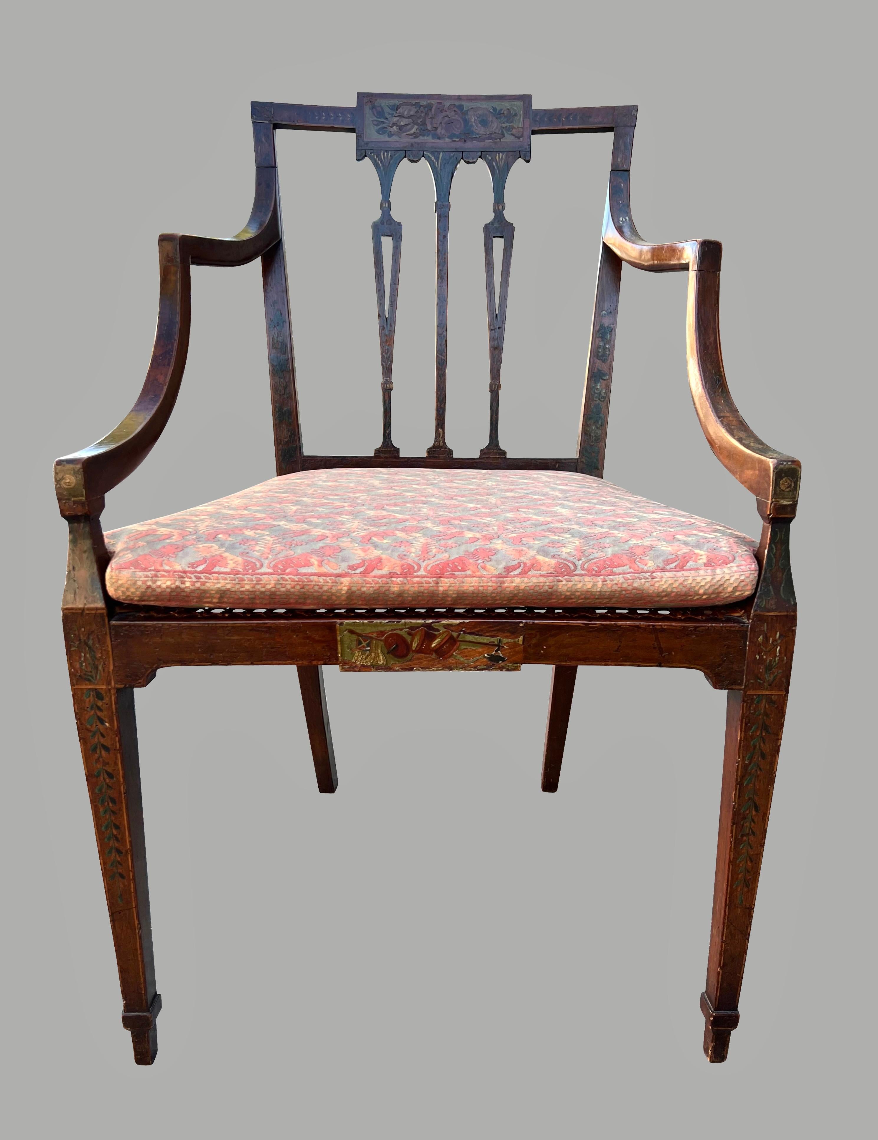 A pretty late 18th century English satinwood Adam style open armchair decorated overall with bellflowers, the square back centered by a further decorated panel depicting a bouquet, the seat frame centered by a similar panel decorated with musical