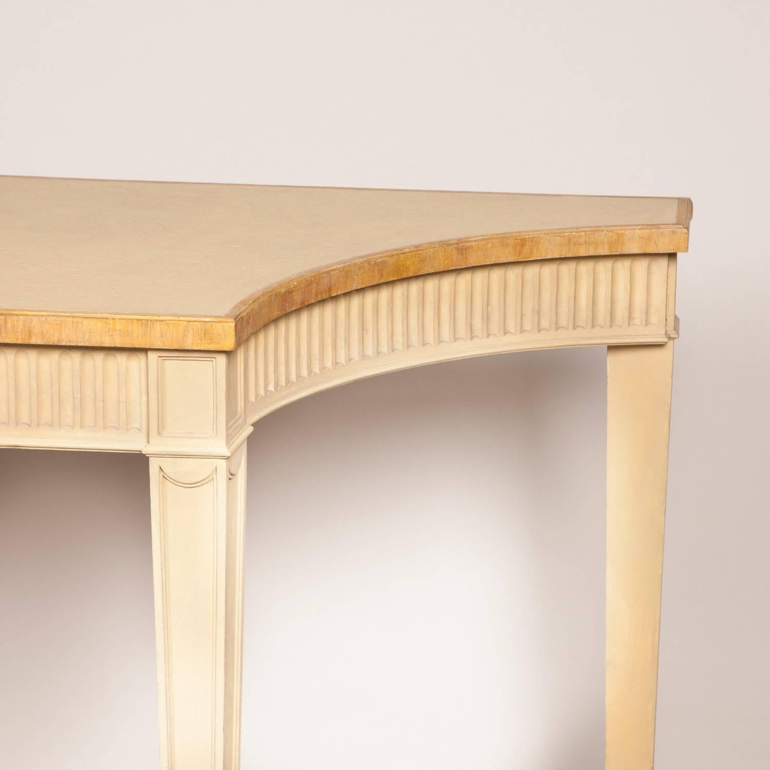 An Adam style painted side table with fluted frieze and square tapered legs from the Royal Box, Ascot, mid-20th century.