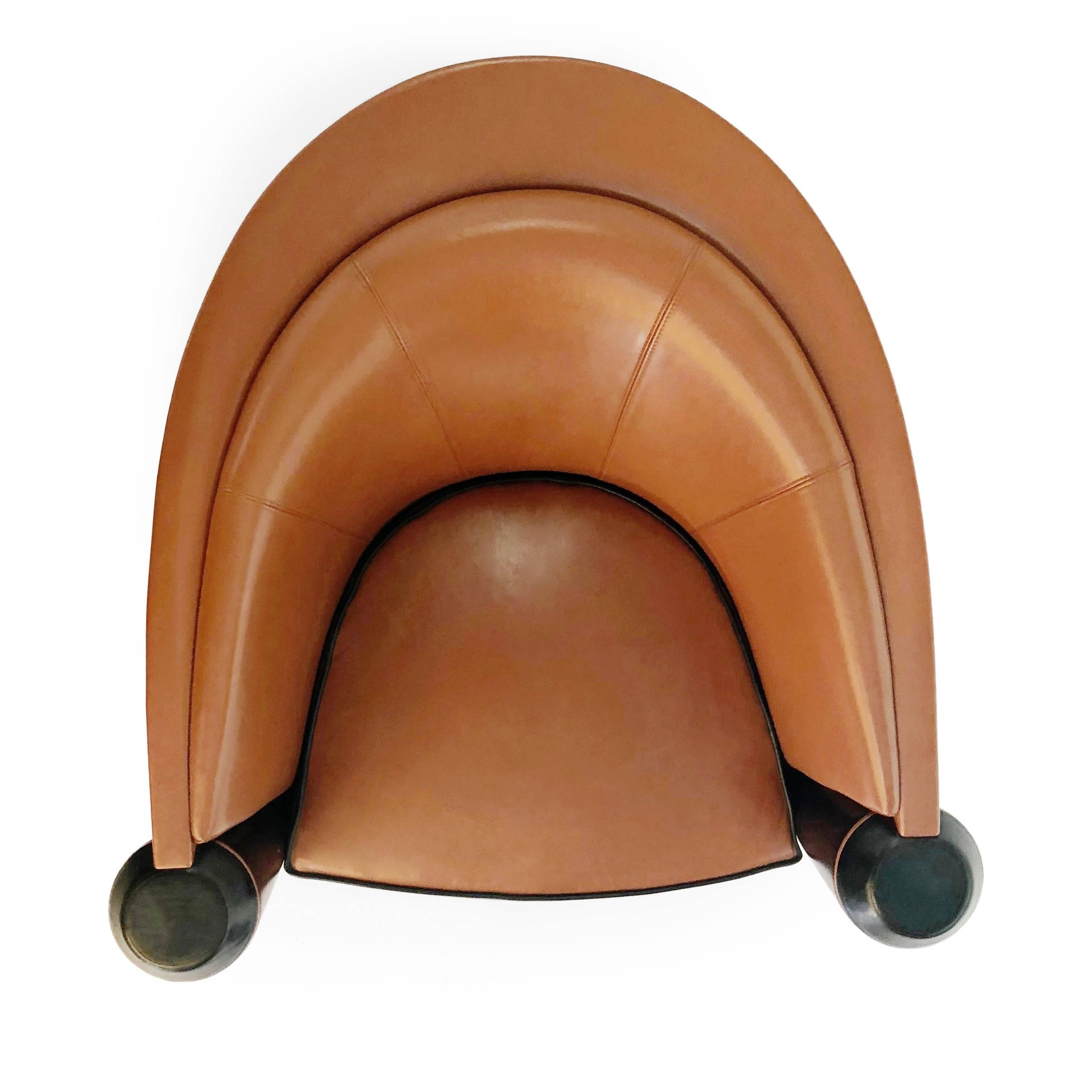 Handsome Art Deco style club chair by Adam Tihany for Pace Mariani, originally retailed for over $9,000. This Italian tub chair features a deeply curved back with two conical shaped armrests which reach down to the floor. These armrests have flat
