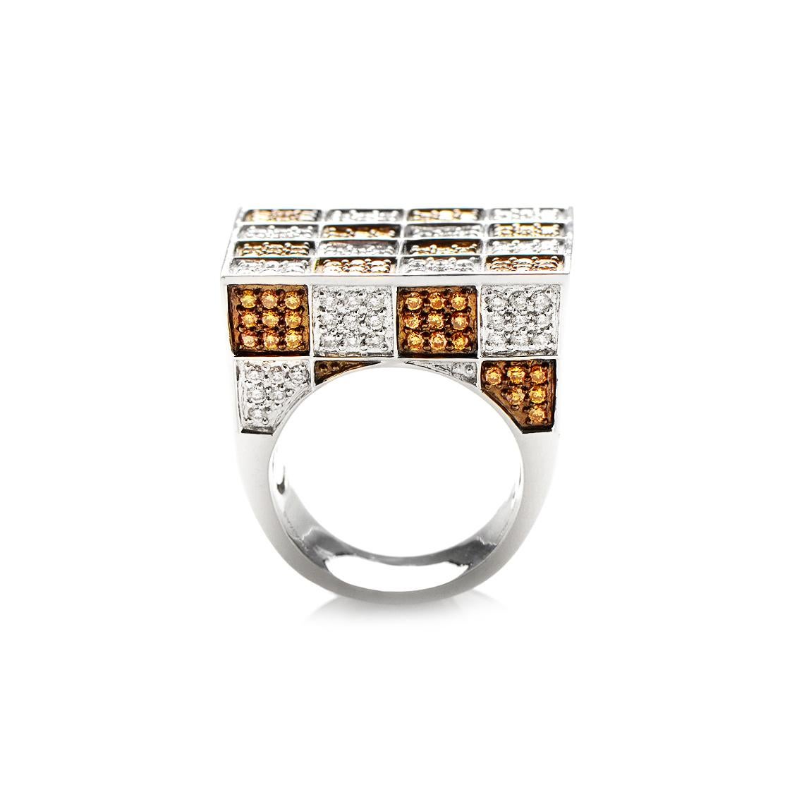 This Adamas cocktail ring is absolutely stunning and compels with its exceptionally unconventional design and dazzling diamond décor. The checkered motif is the star of the show in this exquisitely designed piece and adds a delightful, edgy feel to