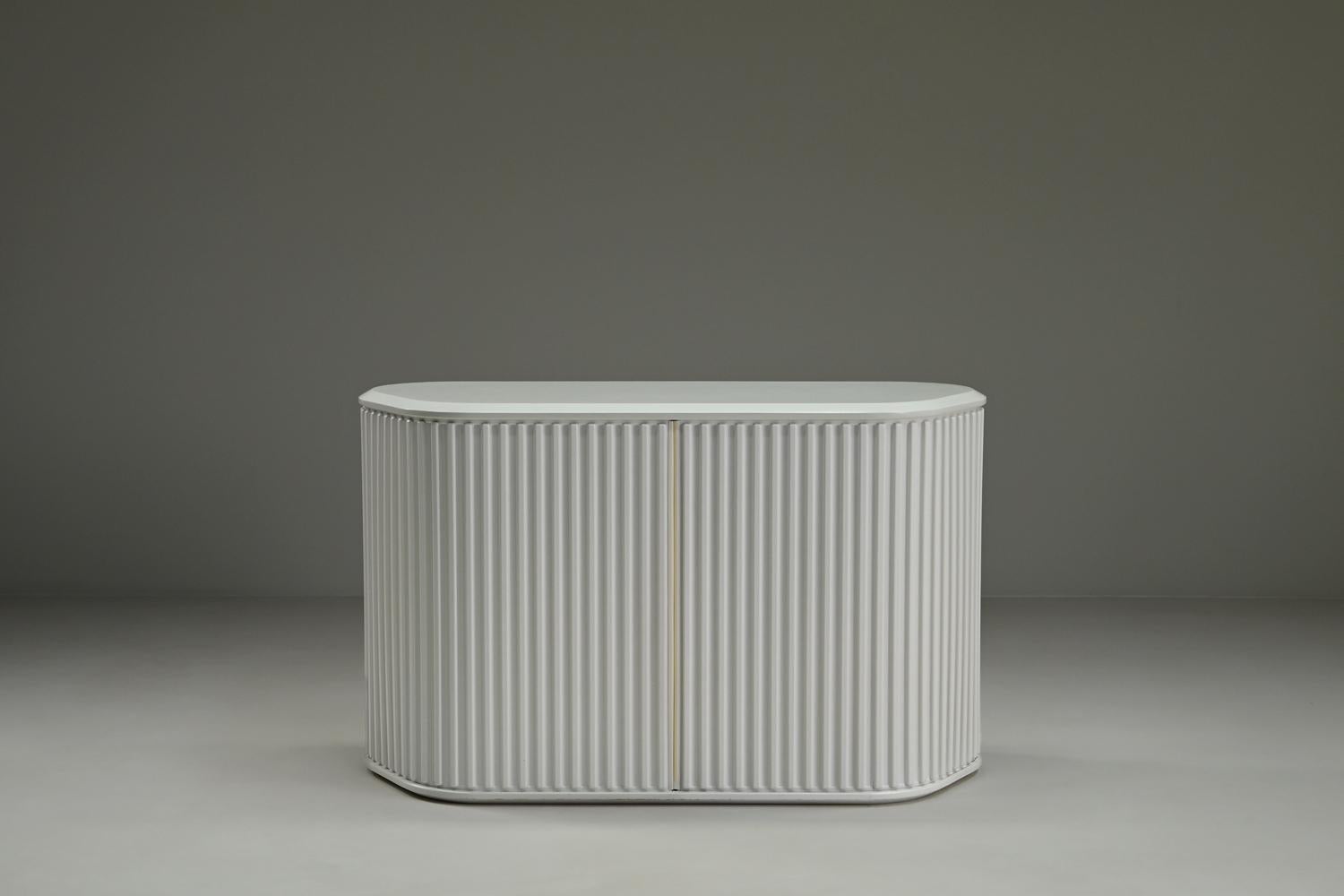 A’dammer sideboard from Aldo van den Nieuwelaar for Pastoe, 1970s The Netherlands. The A’dammer is an icon of Dutch design. Its name refers to the distinctive bollards found throughout the streets of Amsterdam. Characterized by its ribbed roll-front