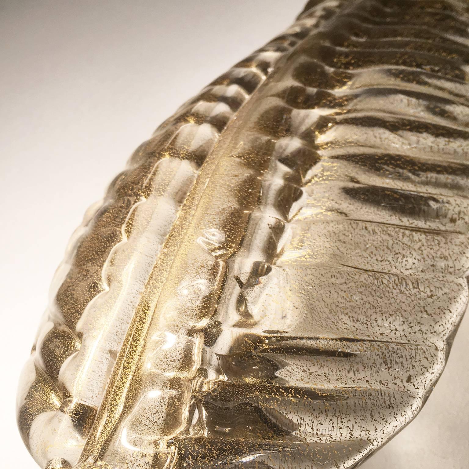 Hand blown leaf shaped Murano glass wall light in clear glass with gold dust and polished chrome fitting.
One E14 bulb fitting.

Two pairs are available.
