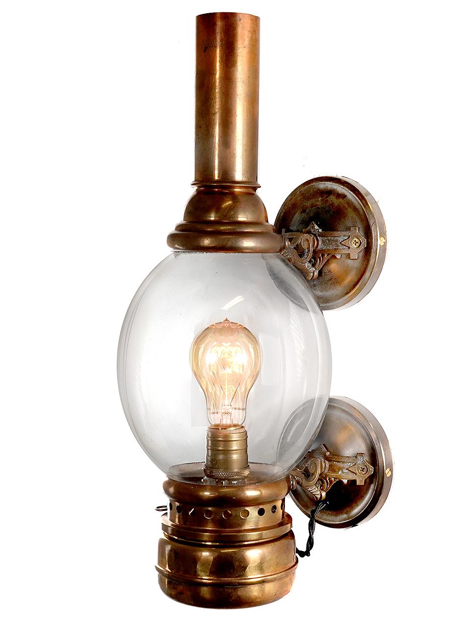 This is a classic egg globe railcar side lamp. We believe it dates to 1880 and was manufactured by Adams and Westlake. It was oil and is now wired to take a standard bulb. This is one of the rare early decorative train car lamps from our collection.