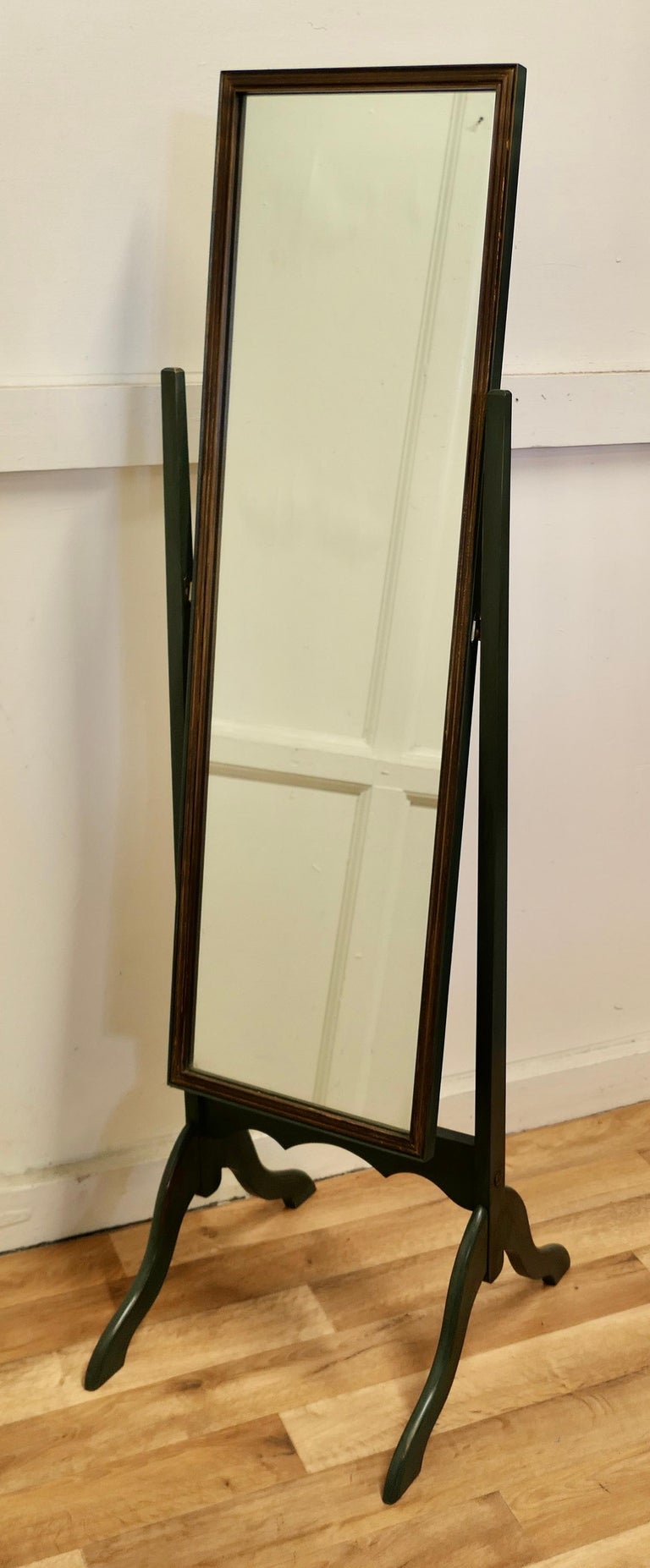 Adams Art Deco green painted cheval mirror

The Mirror is in dark green with a gilt frame, it has a good rectangular shape, it sits firmly in its stand and swivels for maximum advantage
The Stand has a sleek shape with slightly arching splayed