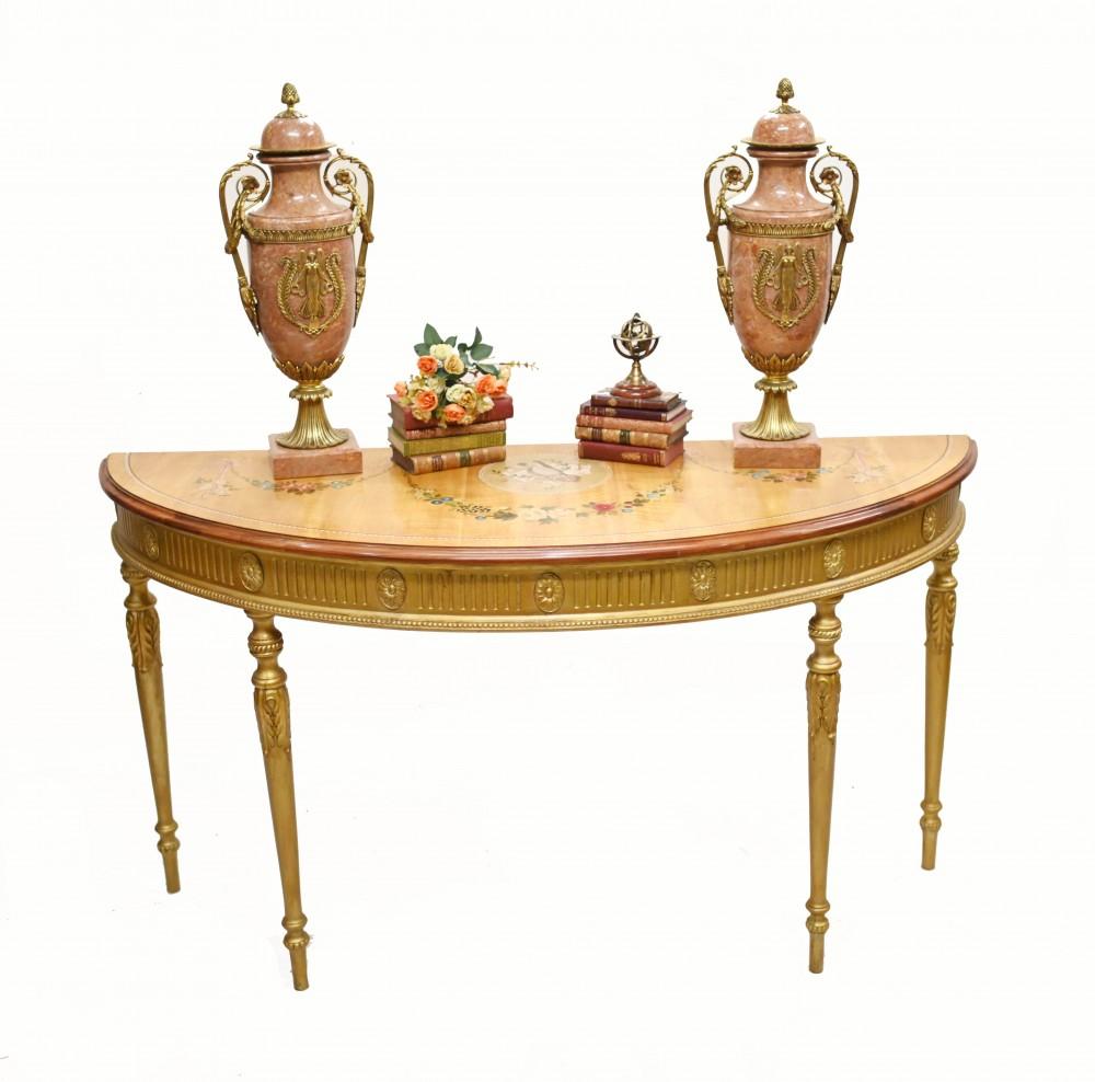 Classy English Adams style gilt console table of demi lune form
Really elegant piece, opulent look with gilt base
Legs are classically fluted and finished in gold gilt
The table top is demi lune - half round - and features intricately hand painted