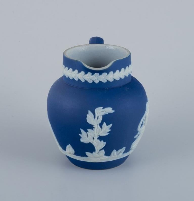 Porcelain Adams, England, cylindrical vase and creamer in biscuit porcelain.  For Sale