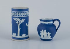 Adams, England, cylindrical vase and creamer in biscuit porcelain. 