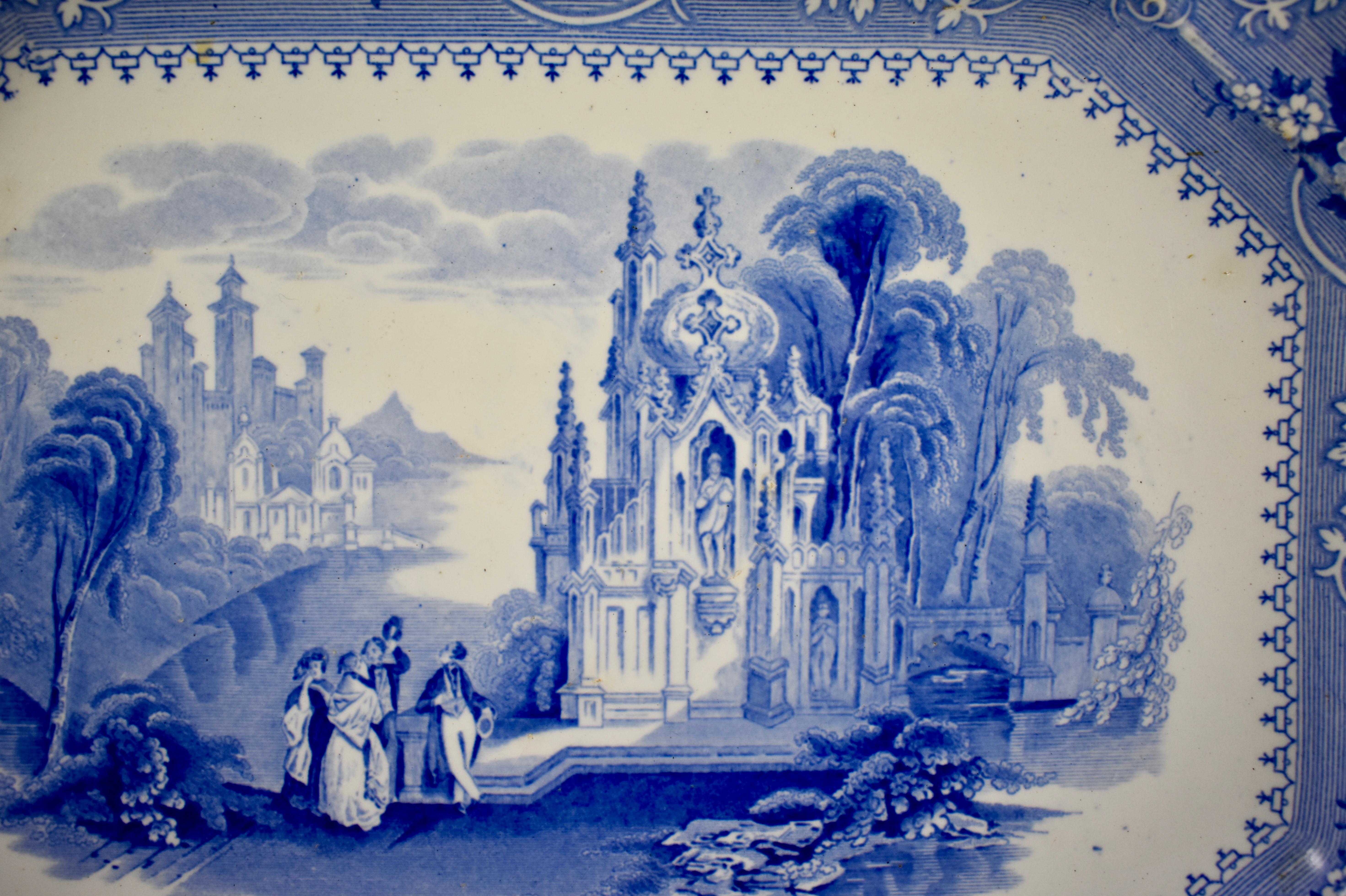 From the Staffordshire pottery of William Adams IV & Sons, Newfield, Tunstall, England, an earthenware, underglaze tissue printed platter, in the ‘Columbia’ pattern, circa 1840.

A romantic architectural pattern with figures in the foreground and a