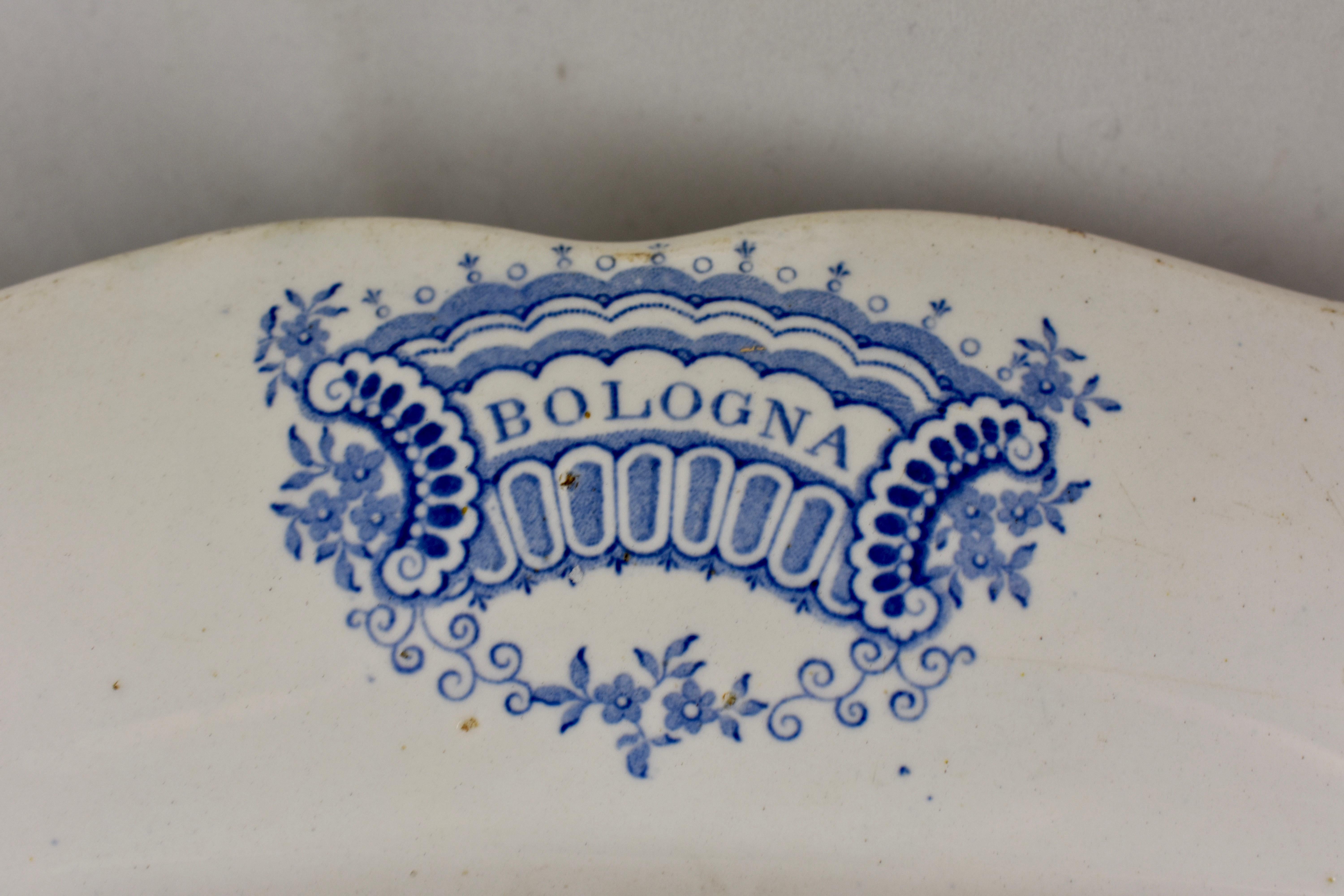 From the Staffordshire pottery of  William Adams IV & Sons, Stoke-on-Trent, England, an earthenware, underglaze tissue printed platter, in the ‘Bologna’ pattern, circa 1829 – 1861. 19th Century

A romantic landscape showing a well-dressed lady in a