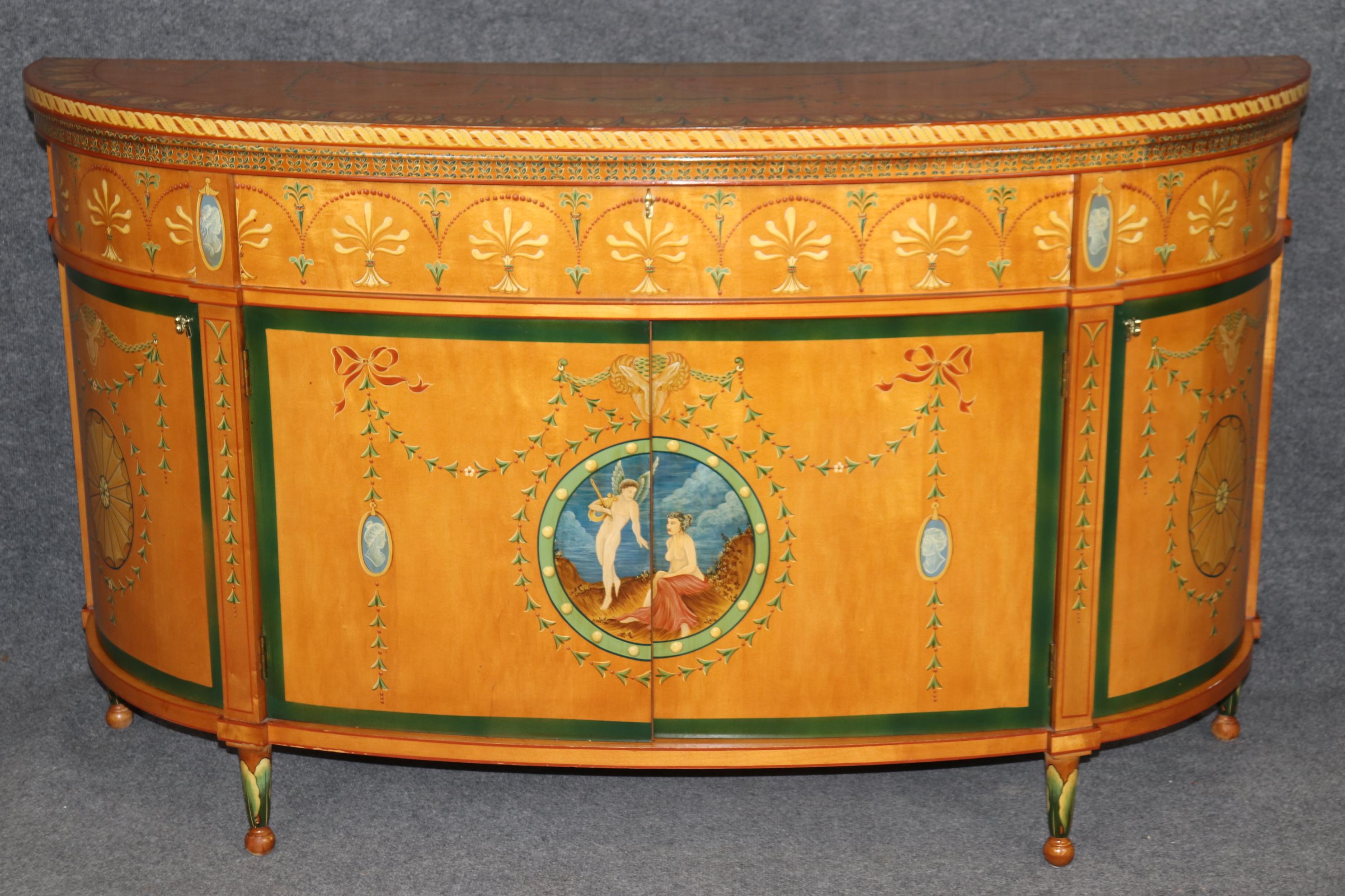 Dimensions - H: 34 3/4 in W: 60 in D: 19 in

This Adams Style Paint Decorated Demilune Sideboard or server, crafted by Historic New England, is a beautifully designed and intricately detailed piece that showcases the style and elegance of