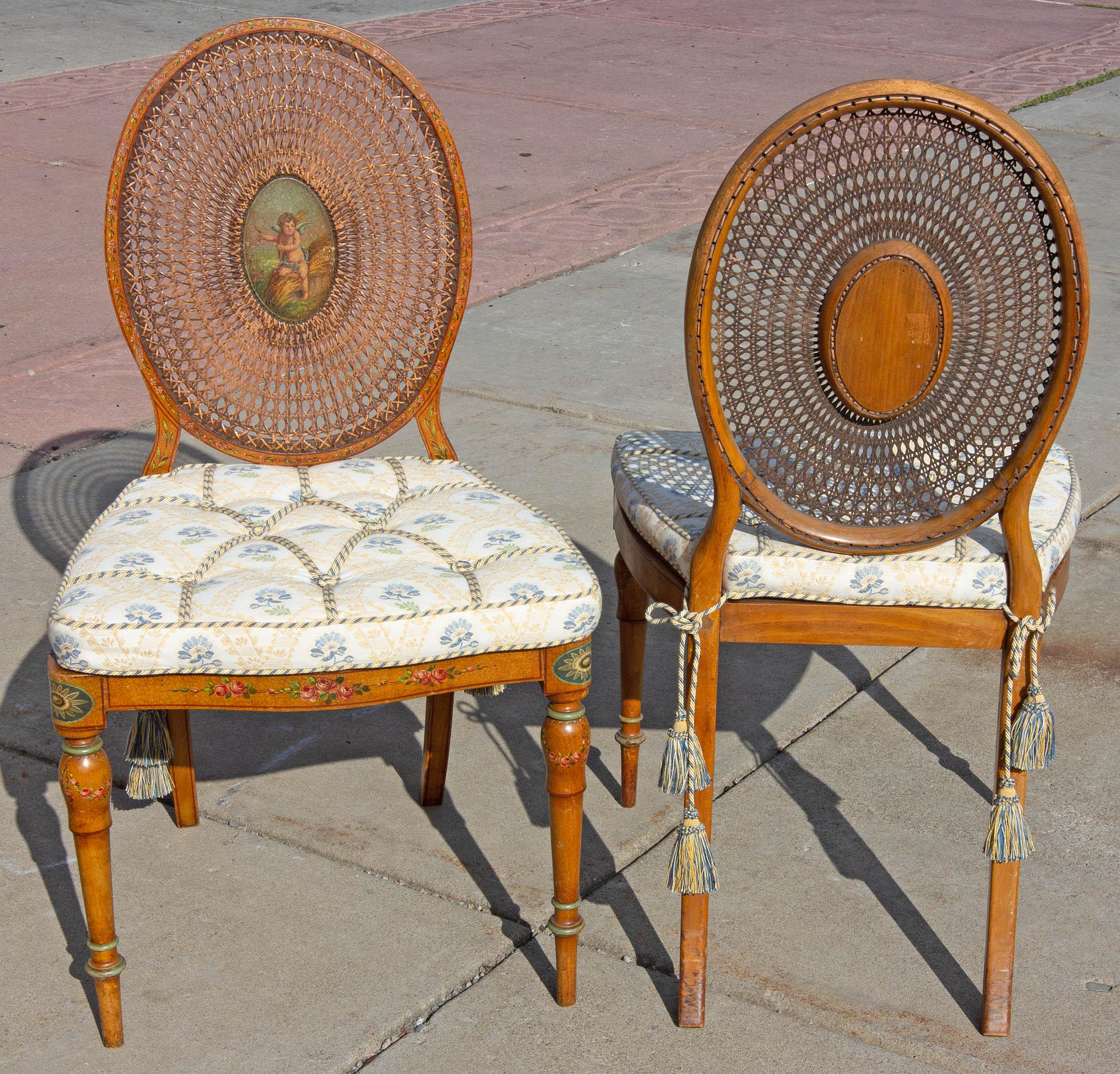 Antique Adams style side chairs. Finely hand painted. Caned backs and seats. Blue, cream, and gold brocade cushions. With silk cords and tassels, circa 1900. Upholstery in like new condition. Chairs are strong.
  
