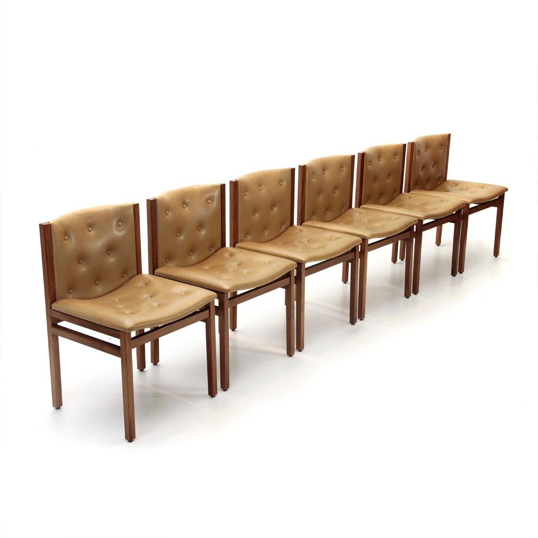 Six chairs produced by La Linea based on a project by Tito Agnoli in the 1960s.
Solid wood frame.
Seat and backrest, padded and lined in leatherette, with stitched buttons.
Good general conditions, some signs due to normal use over