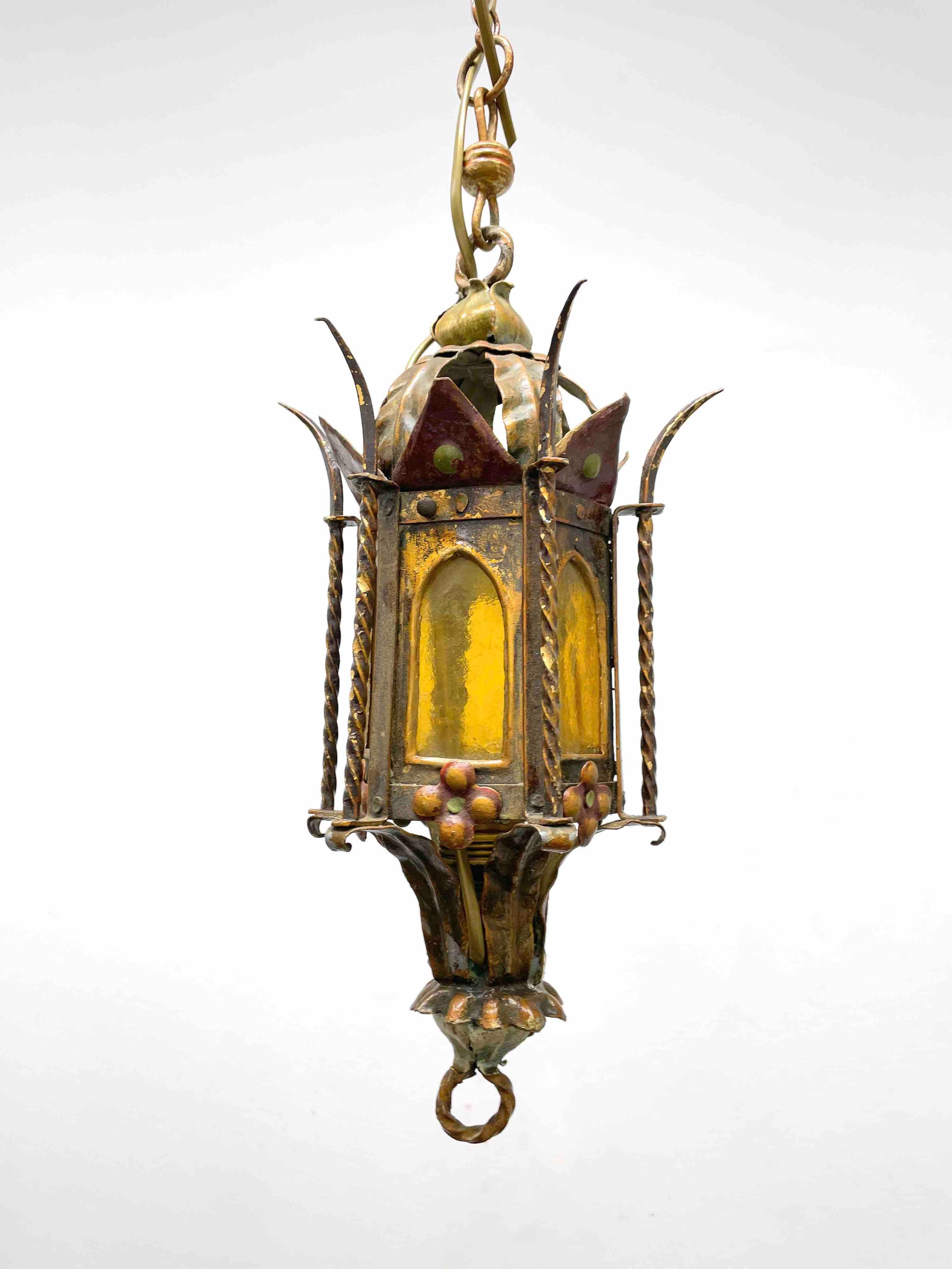 Beautiful Spanish colonial style Lantern Pendant. Nice addition to every home or House. This light fixture remains in very good vintage condition with wear to the glass and some patina to the frame. The Fixture requires one European E27 / 110 Volt