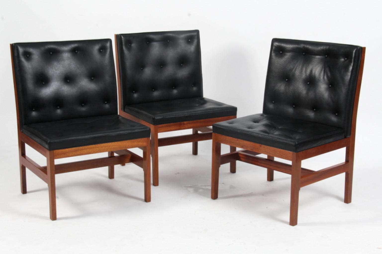 A set of three additional chairs by Mogens Koch. Executed by Rud. Rasmussen.

Mahogany and black leather. 

The reverse with paper labels ‘RUD. RASMUSSENS/SNEDKERIER/COPENHAGEN/DENMARK.