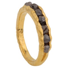 A.deitiy band made with recycled silver, mined diamonds & 3-micron gold plating