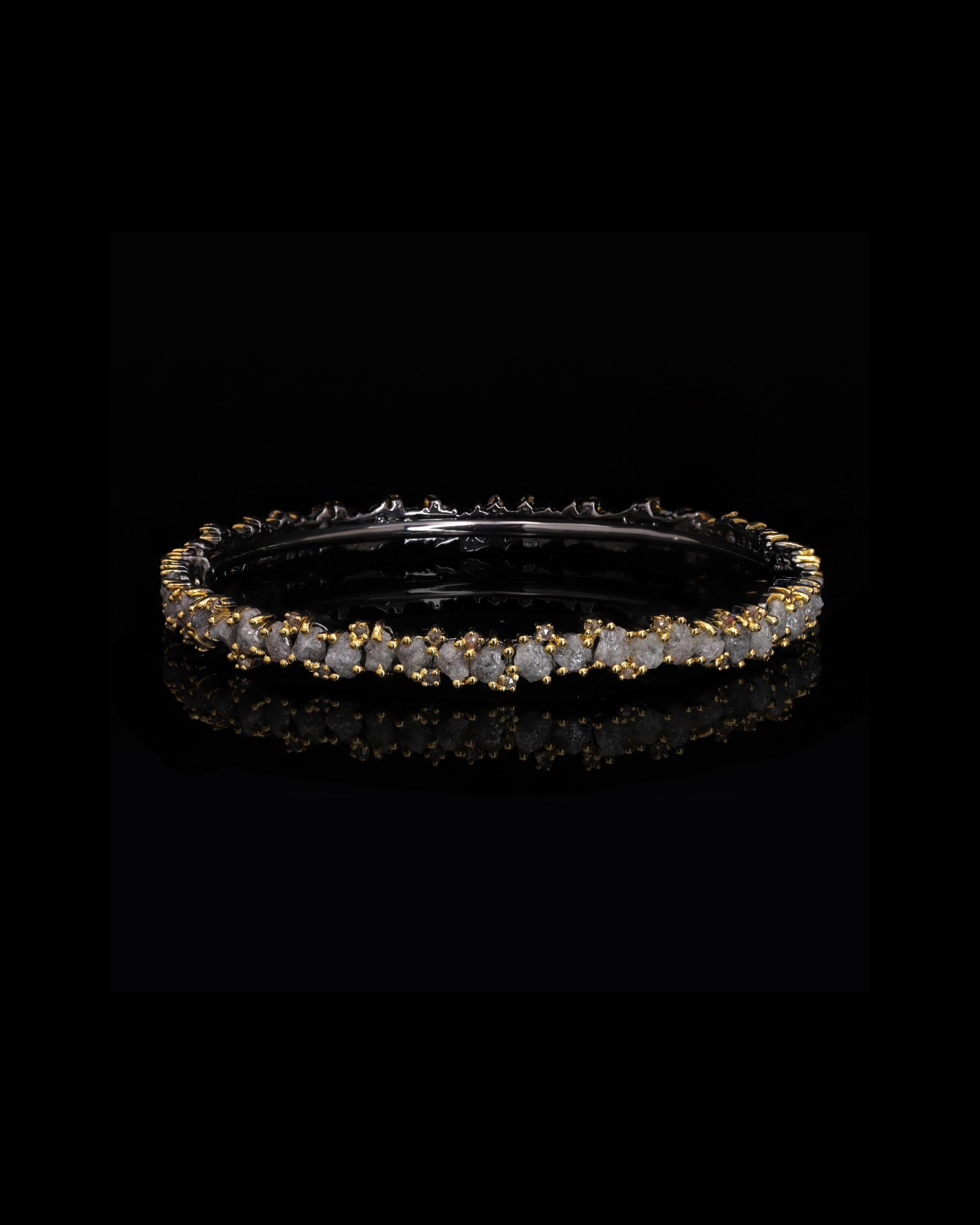 Dive into a world of mystical allure and unbound elegance with our Ecstasy Bangle from the ethereal Eternity Collection. Impeccably crafted and adorned with enchanting gemstones, this bangle embodies the essence of timeless beauty. As you slide it