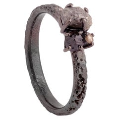 A.deitiy ring made with recycled silver, mined diamonds & black rhodium plating