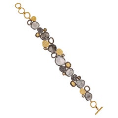 A.deitiy silver bracelet with flat diamonds 
3 micron yellow gold plating
