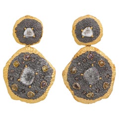 A.deitiy silver earrings with flat diamonds 
3-micron gold 
rhodium plating
