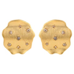 A.deitiy studs made with recycled sterling silver,  18k gold plating and diamond