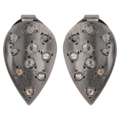 A.deitiy studs made with recycled sterling silver, rhodium plating and diamond