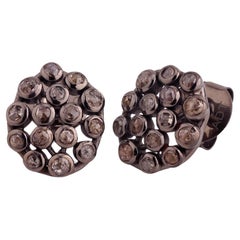 A.deitiy studs made with recycled sterling silver, rhodium plating and diamond