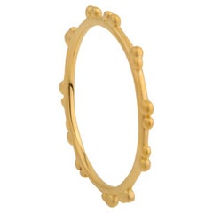 A.deitiy thin band made with recycled silver, and 18k gold plating
