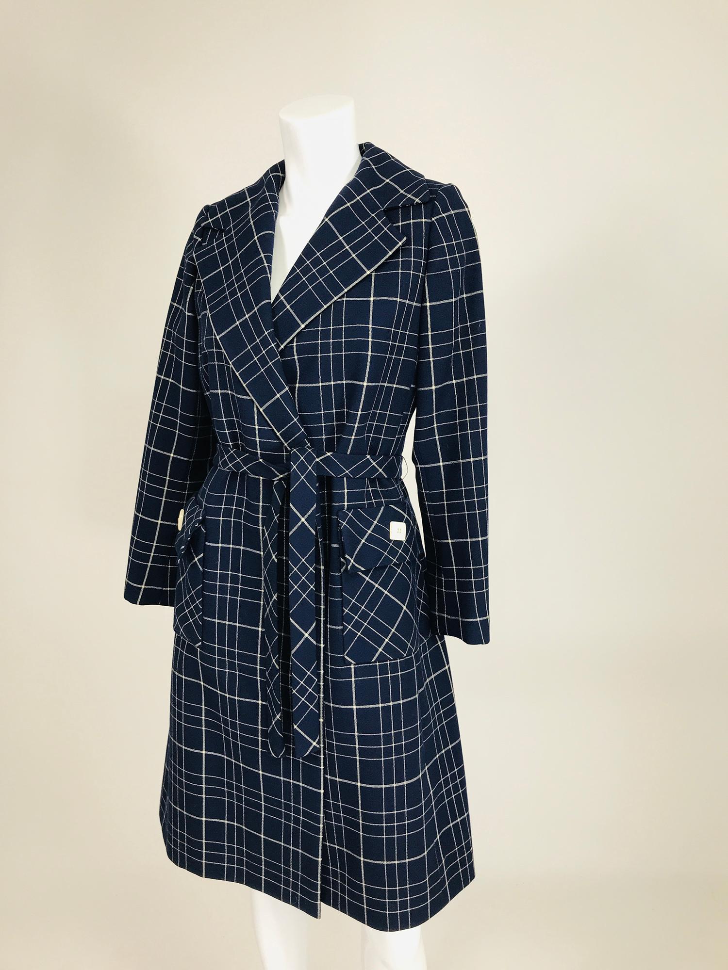 Adele Simpson 1960s navy blue & white wool plaid wrap coat. Stylish, well made coat that will get you complements where ever you go. The woven plaid design is perfectly matched throughout the garment, something rarely found in today's ready to wear