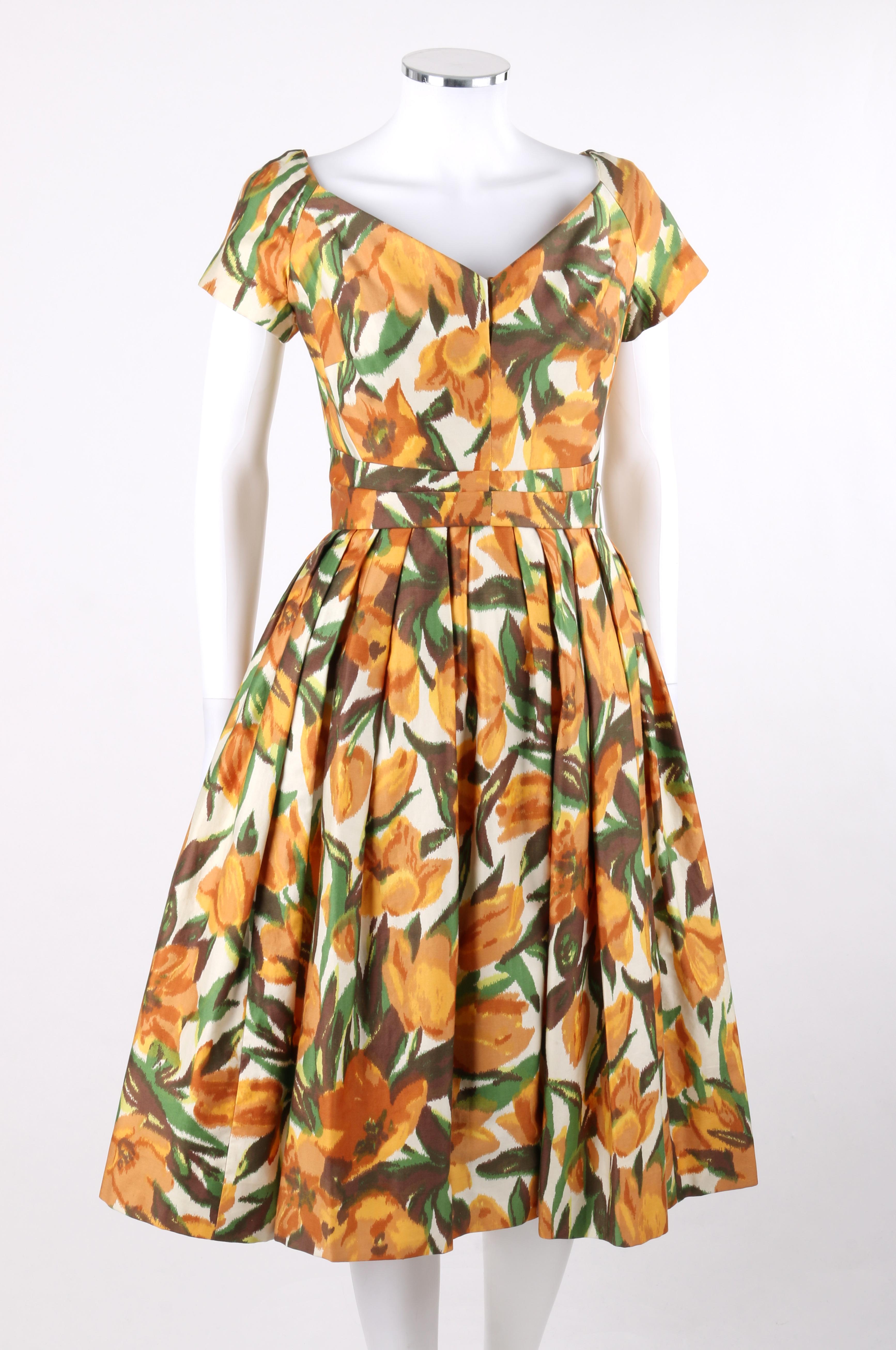 ADELE SIMPSON c.1950s Blooming Tulip Floral Sweetheart Neckline Party Day Dress
 
Circa: 1950’s
Label(s): Adele Simpson
Designer: Adele Simpson
Style: Day dress / knee-length dress
Color(s): Shades of yellow, green, brown, and white (exterior,