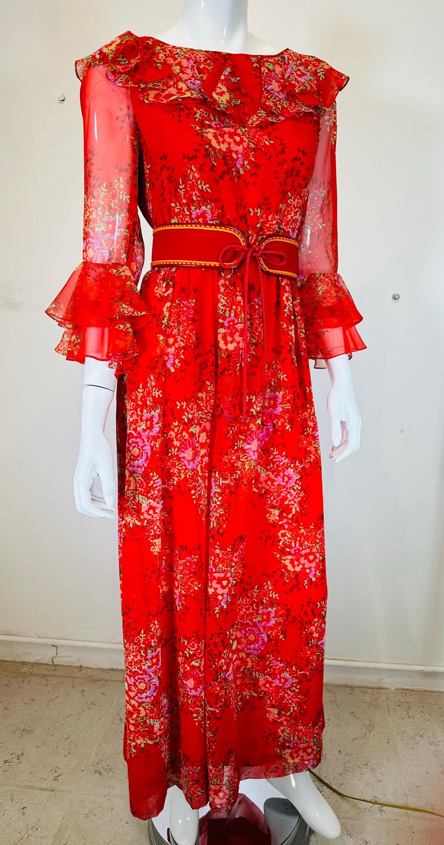 Adele Simpson red floral rayon chiffon ruffle neckline maxi dress from the 1970s. Bateau neck dress with a deep ruffle, fitted bodice dress, 3/4 length sheer sleeves with ruffle cuffs. Not exactly empire the waist is high/short, if you have a long