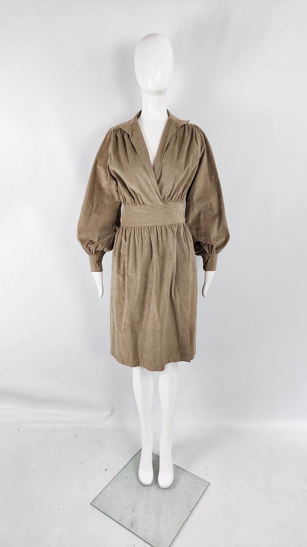 A stunning vintage womens dress from the 70s by luxury American fashion designer, Adele Simpson. In a mushroom / taupe coloured ultrasuede fabric with a wrap style front that gives a nipped waist and a flattering loose, blouson fit on top with