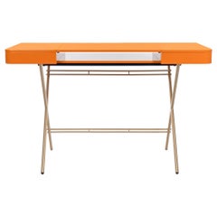 Adentro Cosimo Desk design Marco Zanuso jr Orange glossy top & golden base.