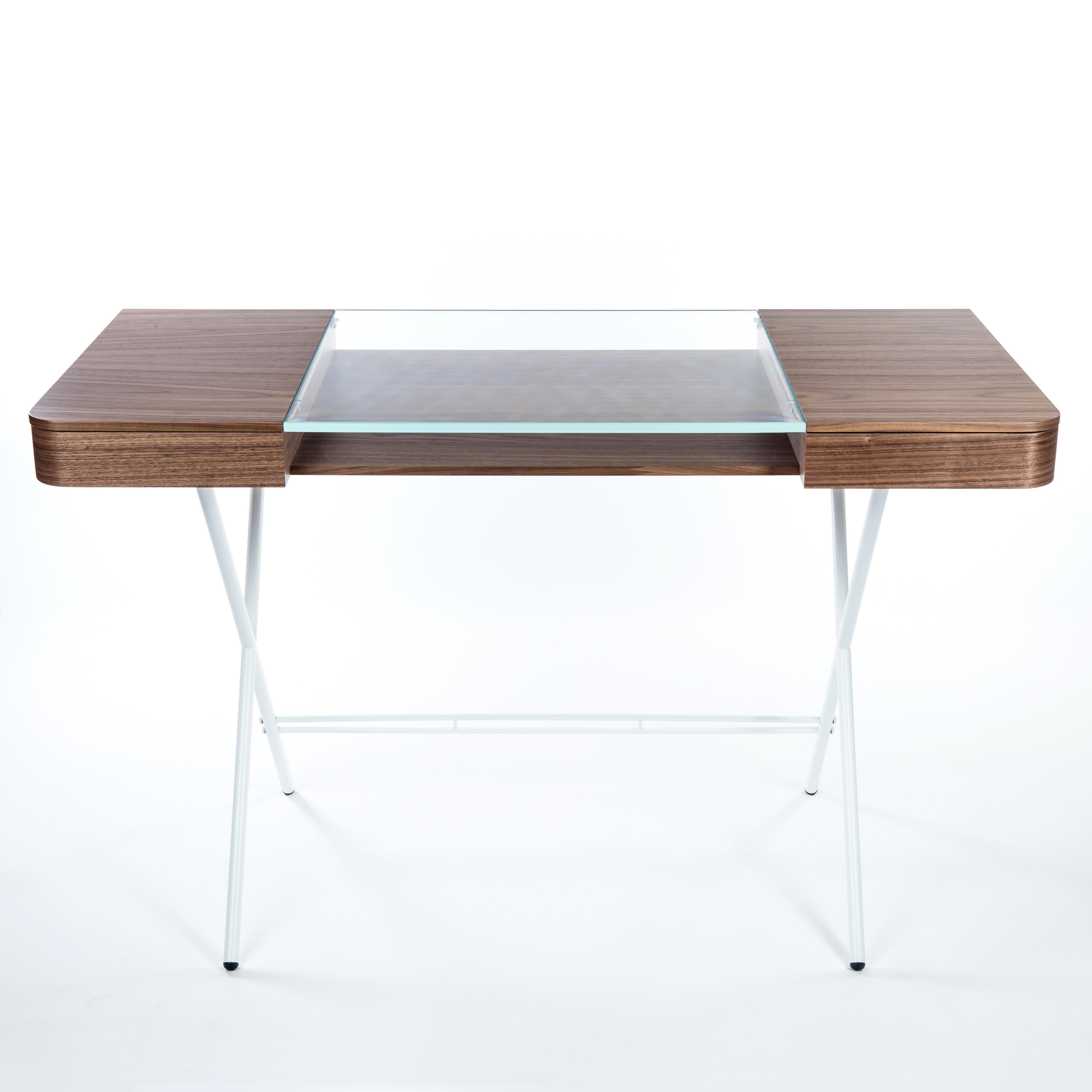 The Cosimo desk was designed by the architect Marco Zanuso Jr for luxury French furniture brand, Adentro Paris.
The desk is composed of a central extra clear glass panel with a storage below and has drawers on either side that provide ample storage