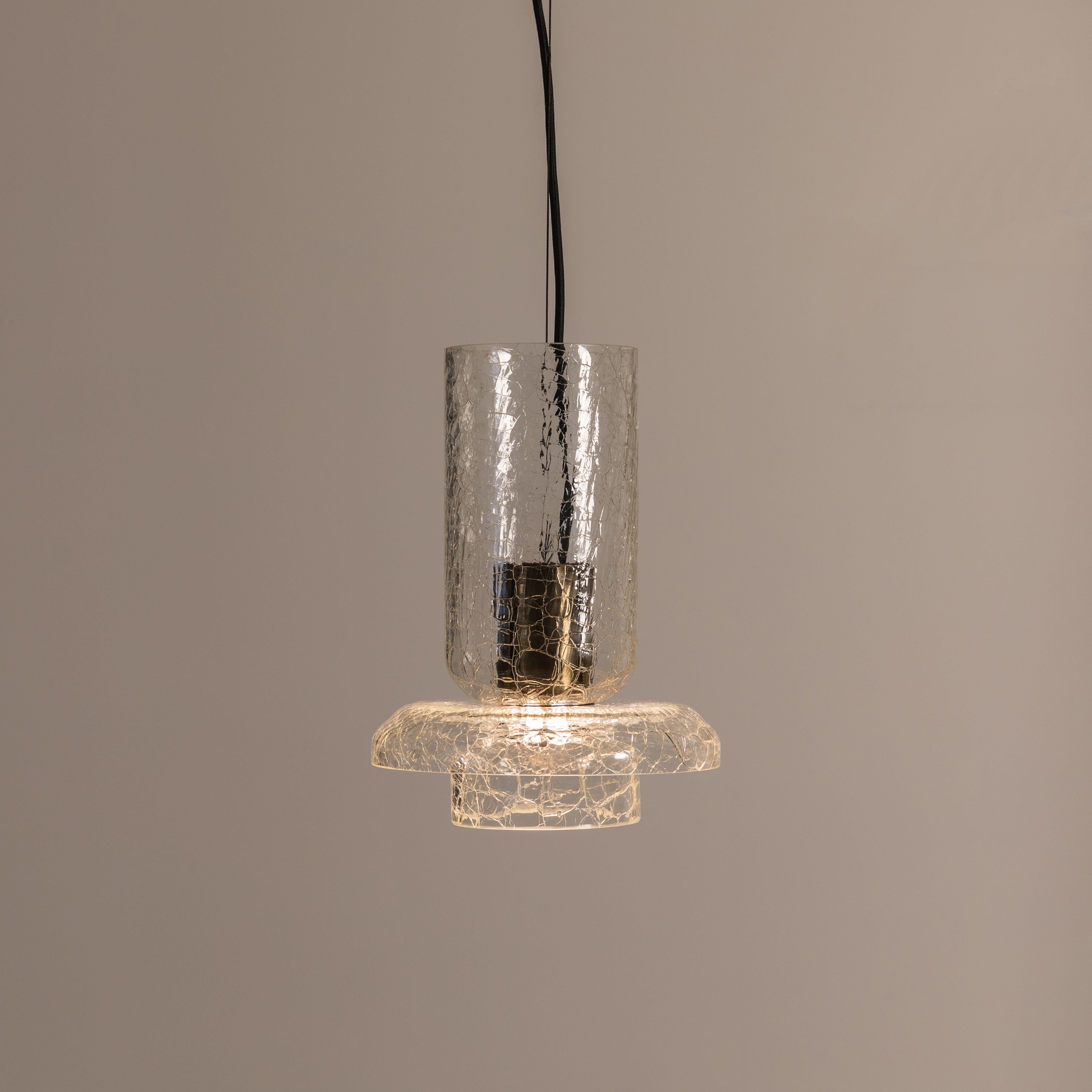 ADesignStudio Crackle S4 Pendant Light
 
ADesignStudio’s Crackle collection sparks intrigue when hung from above. The design draws on Greenway’s system of lighting components referencing Australia’s historic maritime architecture. The outer glass
