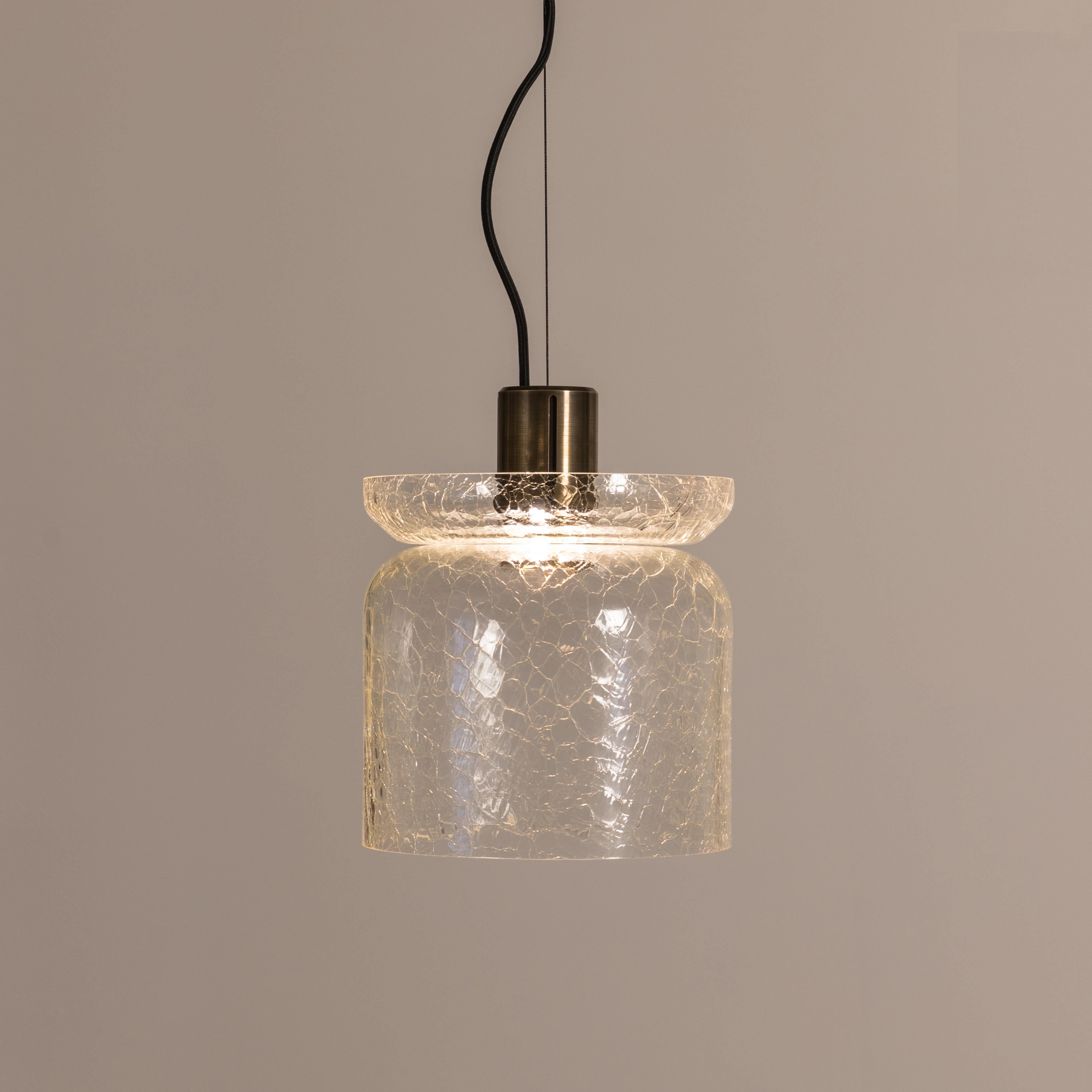 ADesignStudio Crackle S5 Pendant Light
 
ADesignStudio’s Crackle collection sparks intrigue when hung from above. The design draws on Greenway’s system of lighting components referencing Australia’s historic maritime architecture. The outer glass