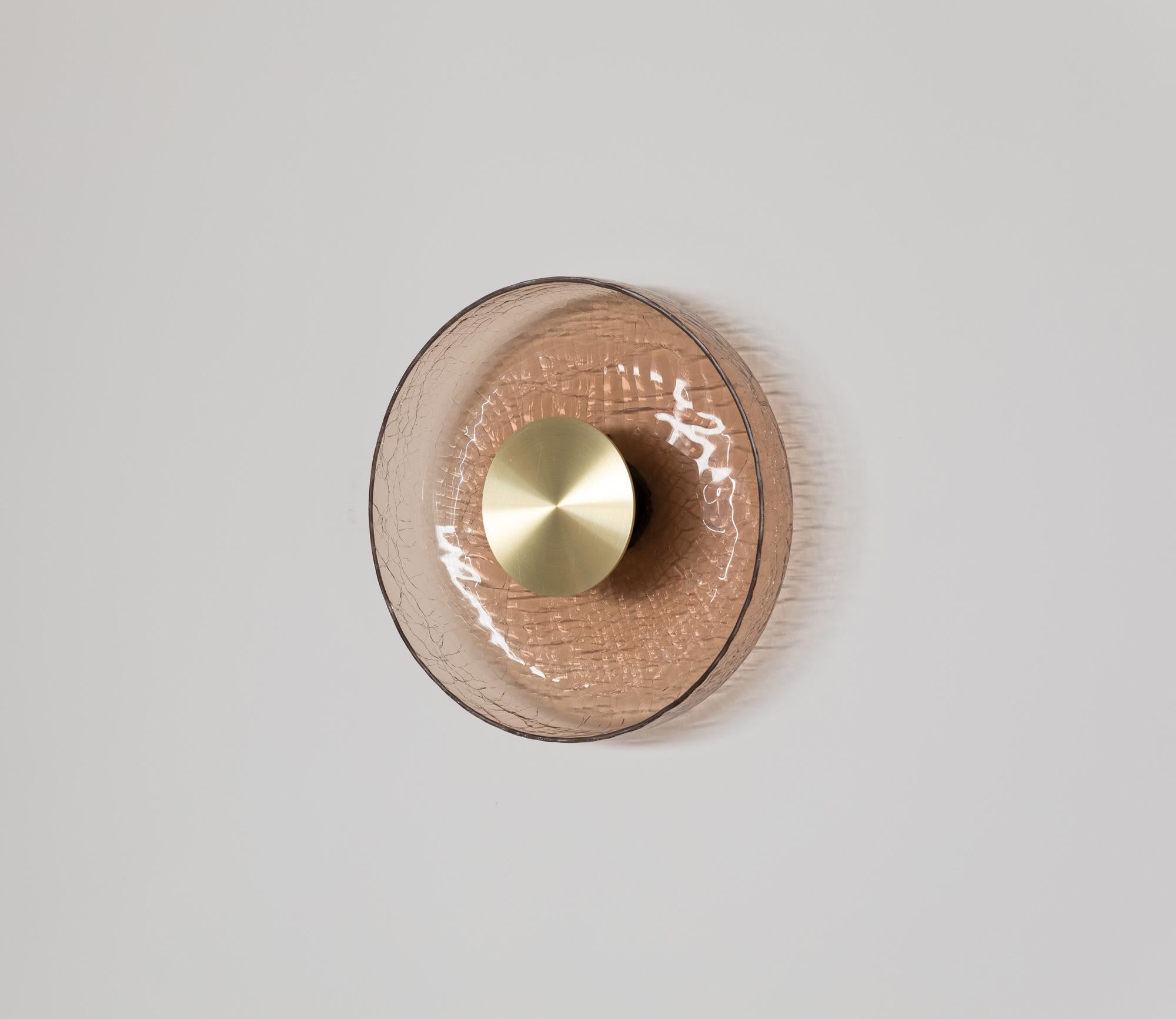 ADesignStudio Crackle W4 Wall Light
 
Extending from the Greenway Crackle Collection, ADesignStudio’s Crackle Wall Lights offer lighting that provides a dramatic and striking visual effect. The gently curved form of the crackle glass fitting pushes