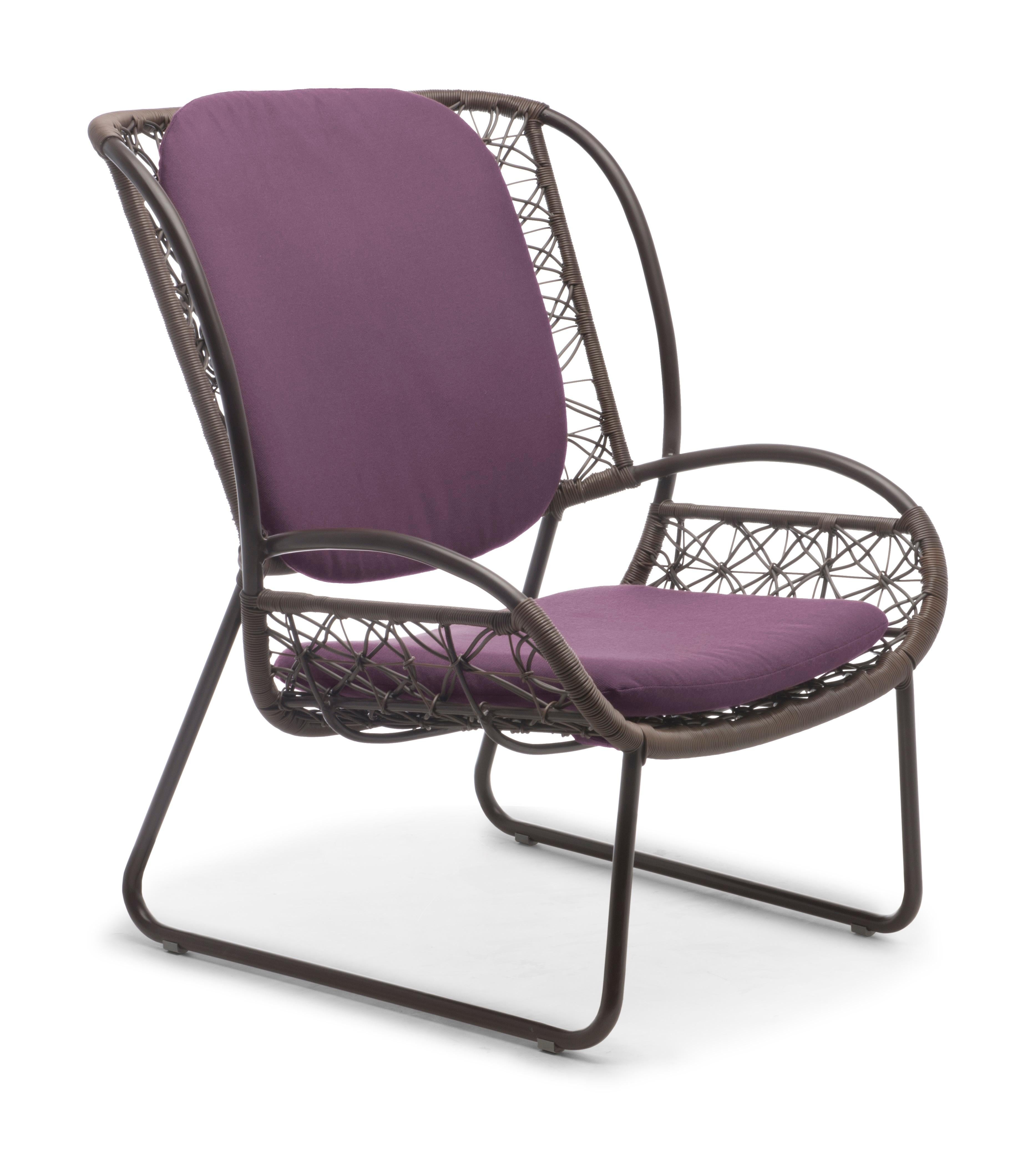 Easy armchair by Kenneth Cobonpue
Materials: Polyethylene. Aluminum. 
Dimensions: 75 x 81 x H 98 cm

The boldly colored frame and geometric weave pattern of the Adesso ottoman and chairs bring to mind a summer field of flowers. Coupled with a