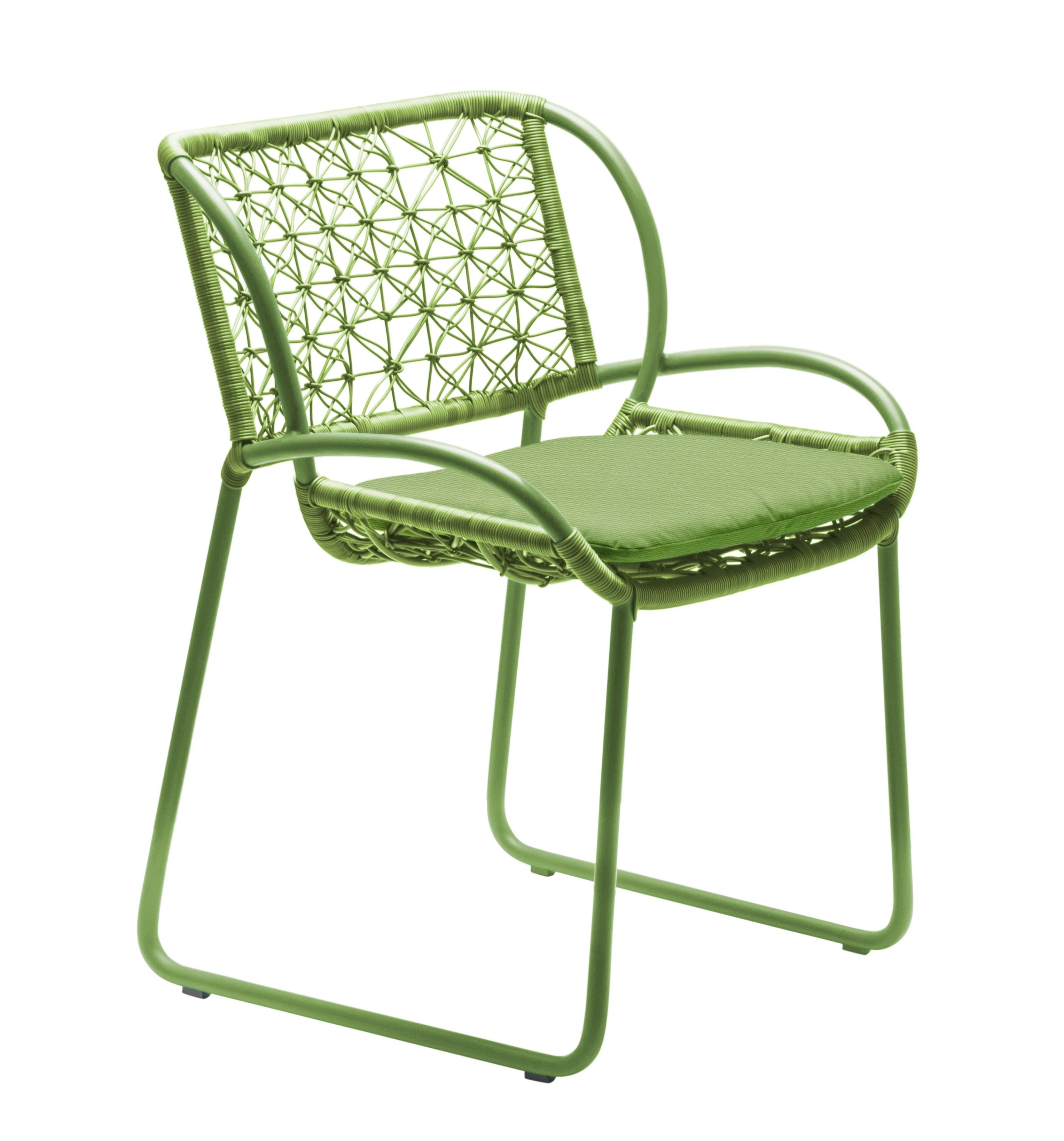 Armchair by Kenneth Cobonpue
Materials: Polyethylene. Aluminum. 
Dimensions: 56 x 59 x H 80 cm

The boldly colored frame and geometric weave pattern of the Adesso ottoman and chairs bring to mind a summer field of flowers. Coupled with a dining