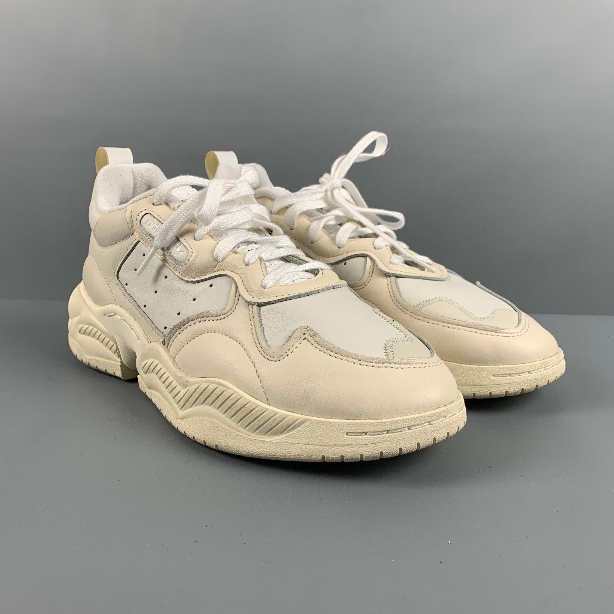 ADIDAS Supercourt RX sneakers in a white leather featuring a low top style, chunky heel, and rubber sole.Very Good Pre-Owned Condition. Minor signs of Wear. 

Marked:   US 10Outsole:12.25 inches  x 5.5 inches 
  
  
 
Reference: 127375
Category: