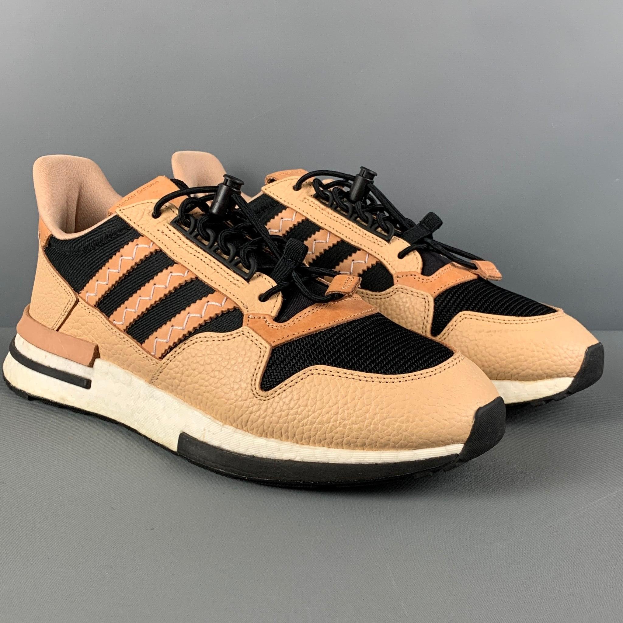 ADIDAS X HENDER SCHEME sneakers comes in a tan & black mixed materials featuring a low-top style, rubber sole, and a adjustable elastic lace up closure. Includes box. Very Good
Pre-Owned Condition. 

Marked:   10.5Outsole: 12.5 inches  x 4.5 inches